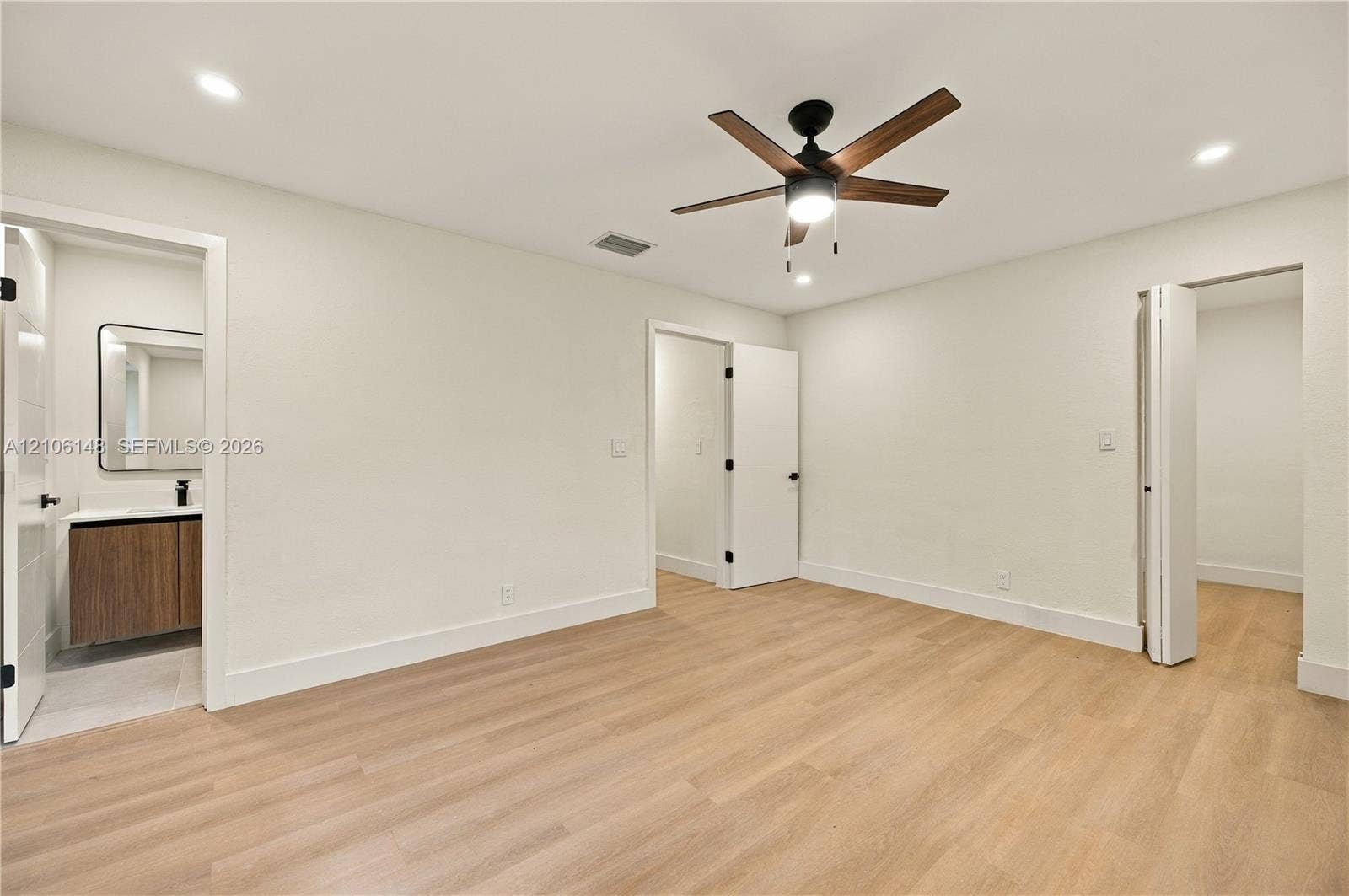 2920 Dorson Way, Delray Beach, FL 33445 Room featuring wood-finish flooring, recessed lighting, and a central ceiling fan with integrated lighting