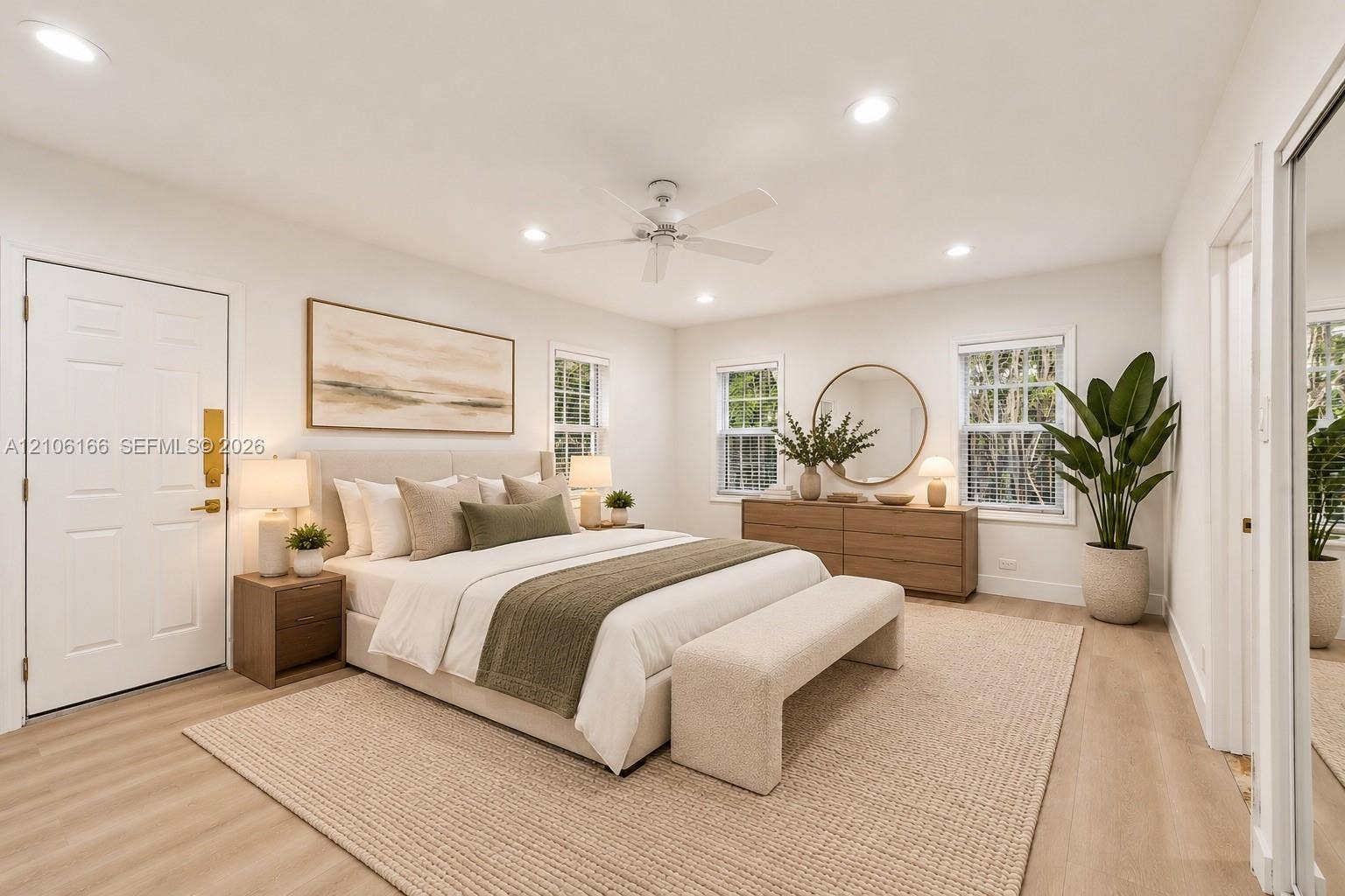 299 S Biscayne River Drive, Miami, FL 33169 Neutral-toned room featuring wood-finish flooring, recessed lighting, a white ceiling fan, and multiple windows
