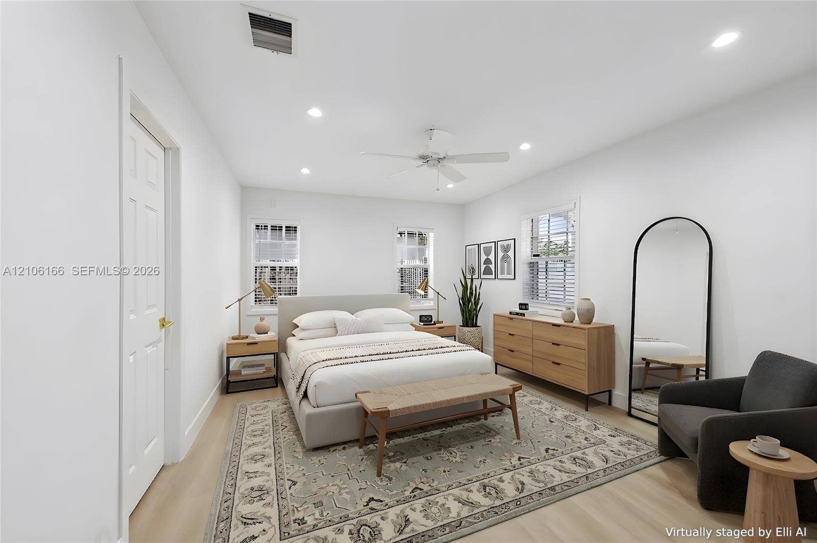 299 S Biscayne River Drive, Miami, FL 33169 Light-filled room featuring wood-finish flooring, recessed lighting, a white ceiling fan, and three windows with white muntins