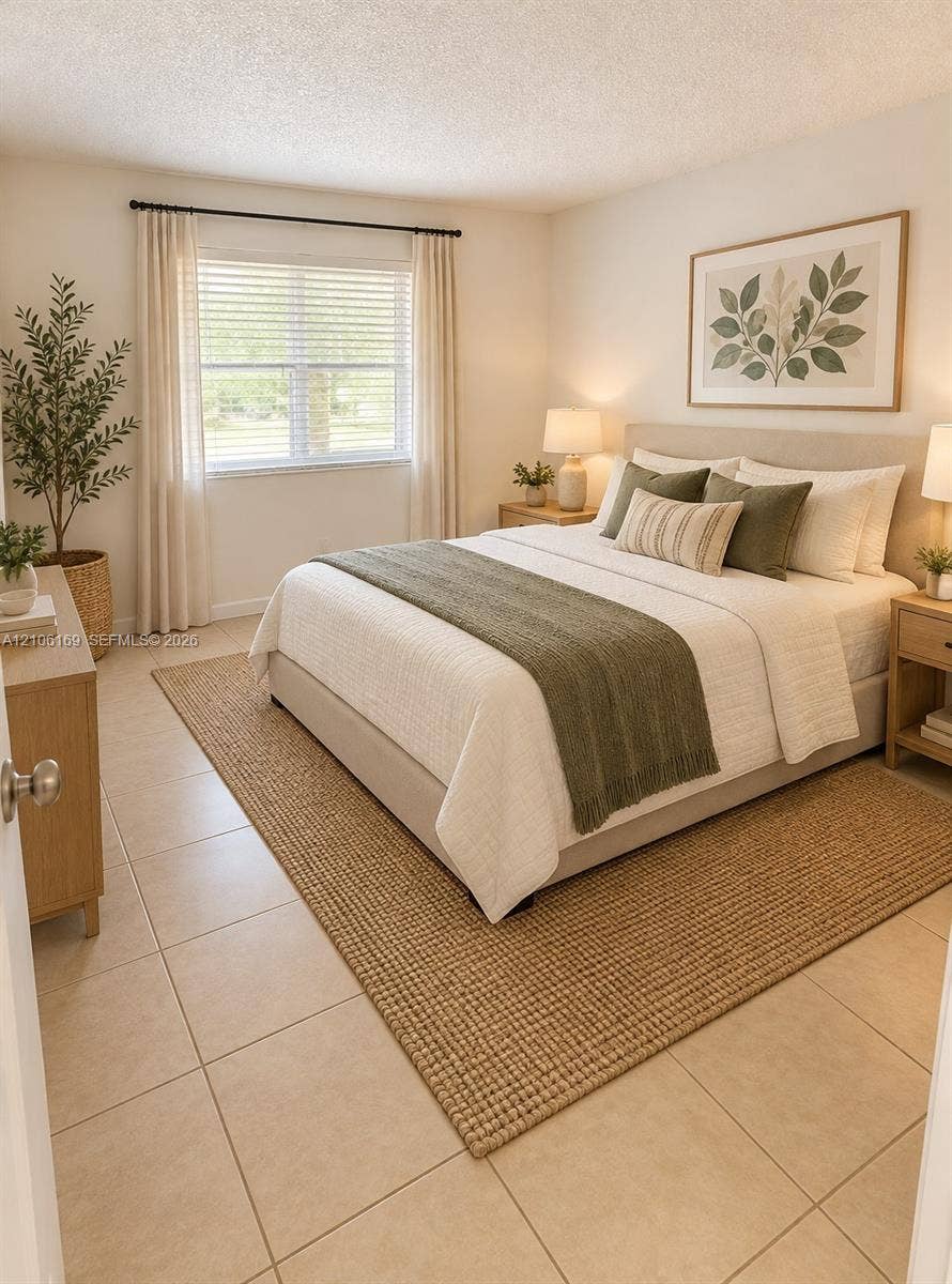 10820 SW 200th Drive, #162, Cutler Bay, Cutler Bay, FL 33157 Neutral tile flooring, large single-hung window with black hardware, and crisp off-white wall finishes