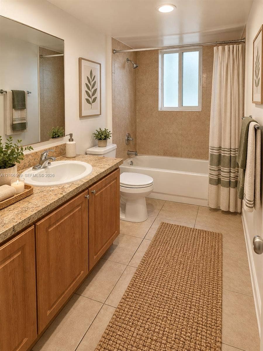 10820 SW 200th Drive, #162, Cutler Bay, Cutler Bay, FL 33157 Bathroom featuring a wood-finish vanity with a stone-composite countertop, integrated sink, tile flooring, and a tiled shower-tub surround