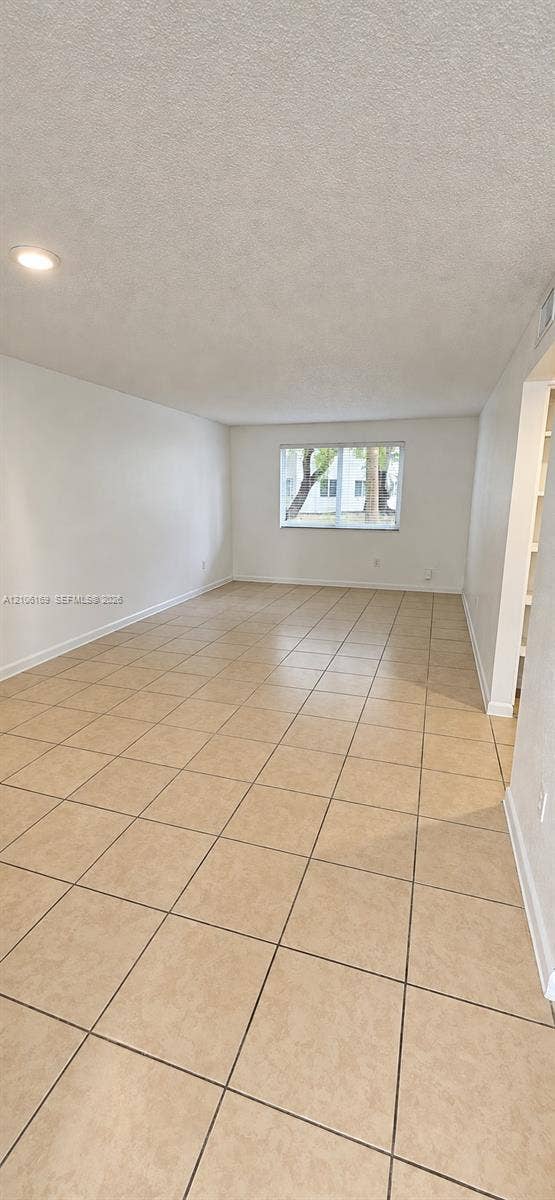 10820 SW 200th Drive, #162, Cutler Bay, Cutler Bay, FL 33157 Open floor plan featuring neutral ceramic tile flooring, recessed lighting, and a window providing natural light