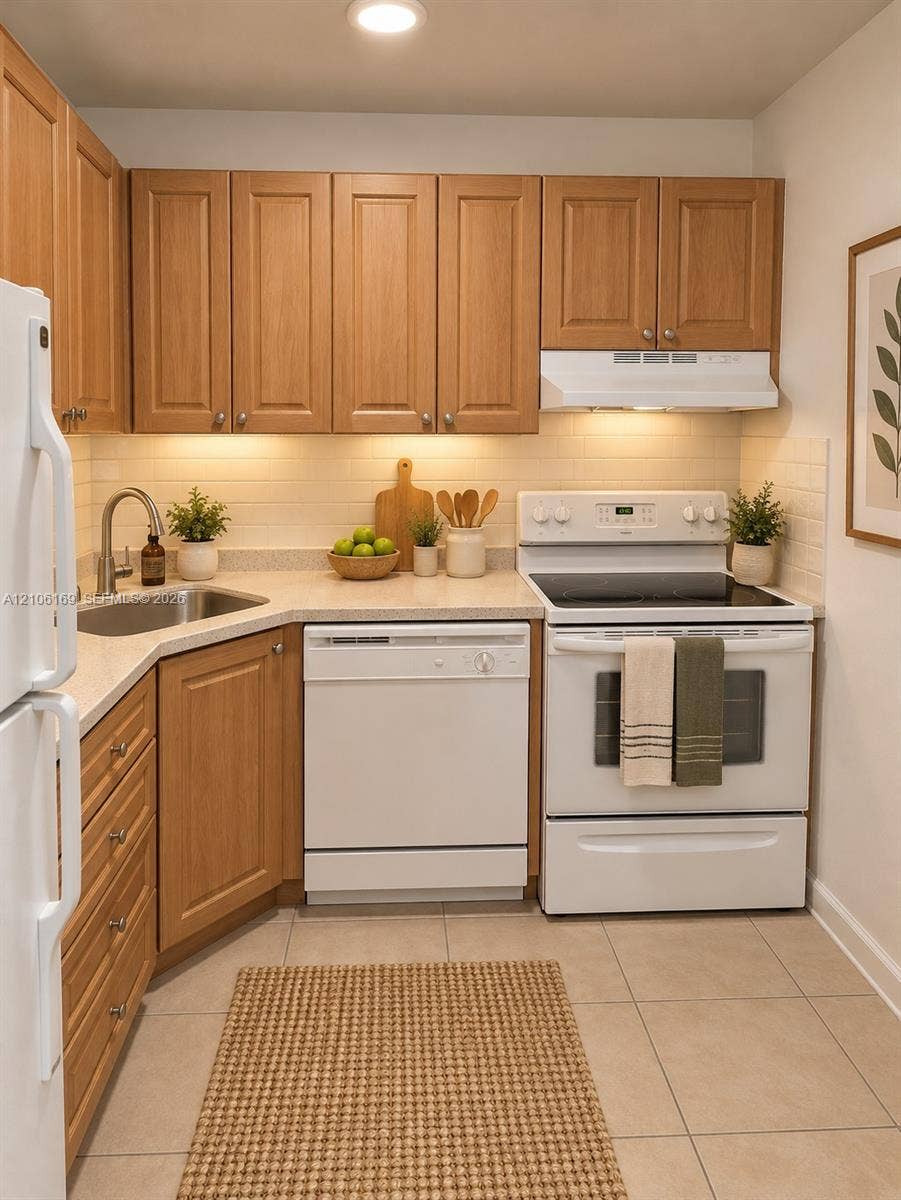 10820 SW 200th Drive, #162, Cutler Bay, Cutler Bay, FL 33157 Kitchen featuring wood cabinetry, solid-surface countertops, tile backsplash, white appliance suite, and ceramic tile flooring