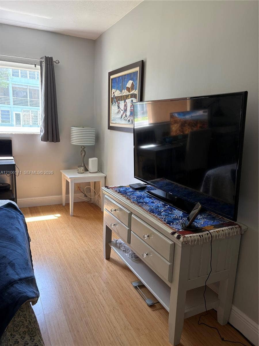 Wood-finish flooring and a single-pane window