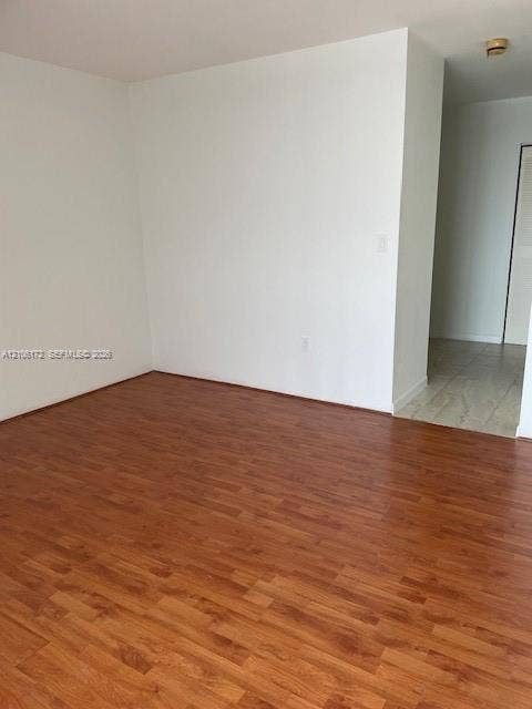 20515 E Country Club Drive, #246, Aventura, Aventura, FL 33180 Neutral interior space featuring wood-finish flooring and ceramic tile flooring