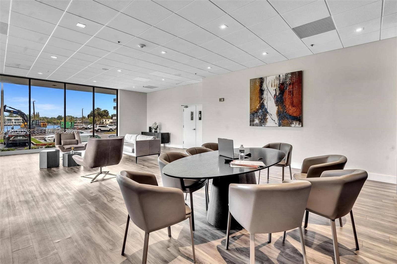 20515 E Country Club Drive, #246, Aventura, Aventura, FL 33180 Open floor plan featuring wood-finish flooring, recessed lighting, drop ceiling grid, and floor-to-ceiling windows