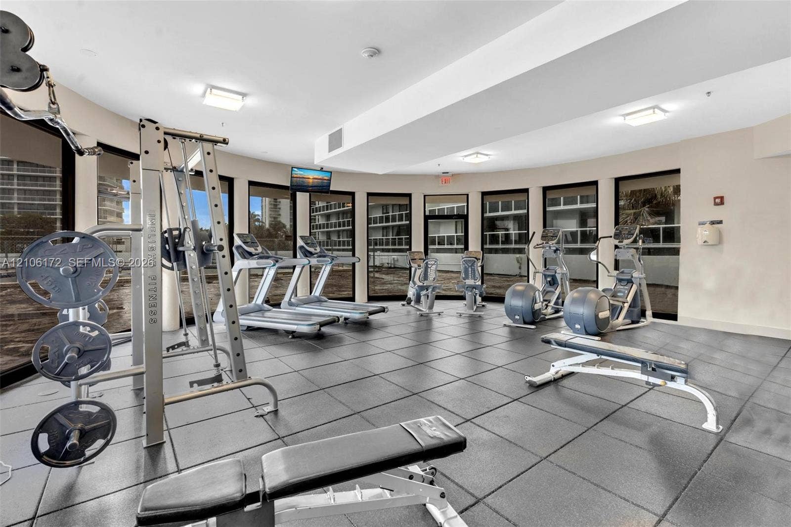 20515 E Country Club Drive, #246, Aventura, Aventura, FL 33180 Fitness center featuring rubberized tile flooring, recessed lighting, and a wall of floor-to-ceiling windows