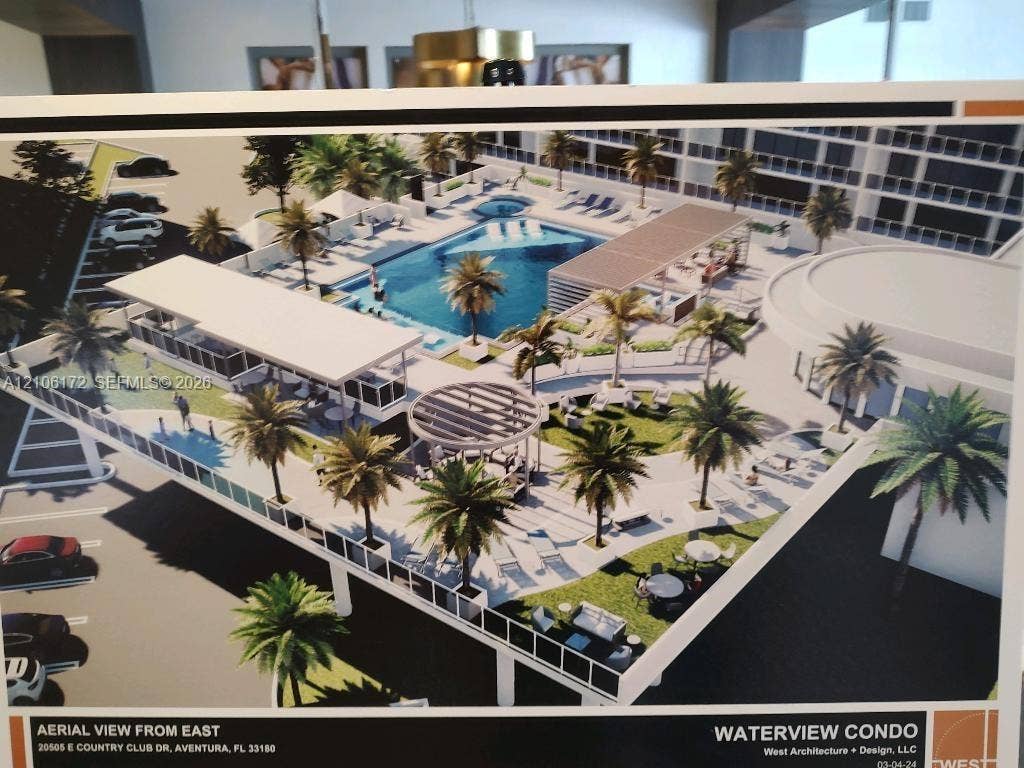 20515 E Country Club Drive, #246, Aventura, Aventura, FL 33180 Outdoor recreational deck featuring a swimming pool, covered pavilion, circular pergola, landscaped green space, and palm trees