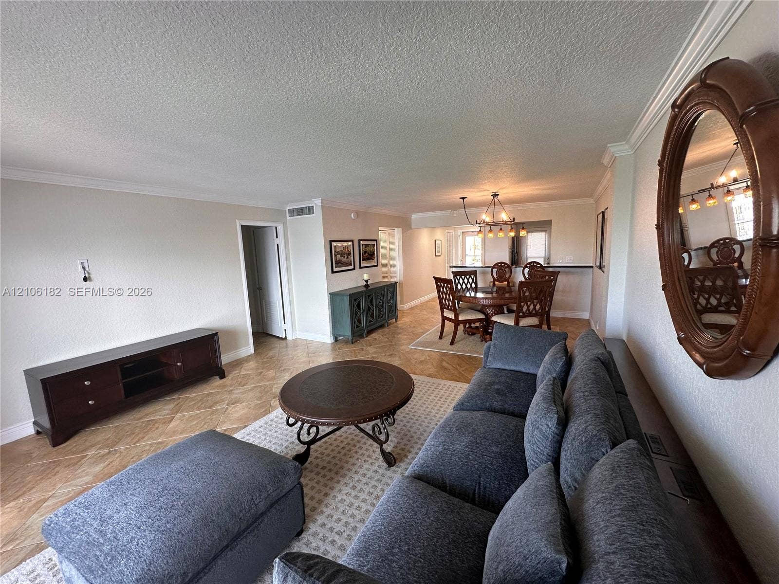 400 Golden Isles Drive, #40, Hallandale Beach, Hallandale Beach, FL 33009 Diagonal tile flooring, crown molding, and neutral interior paint palette