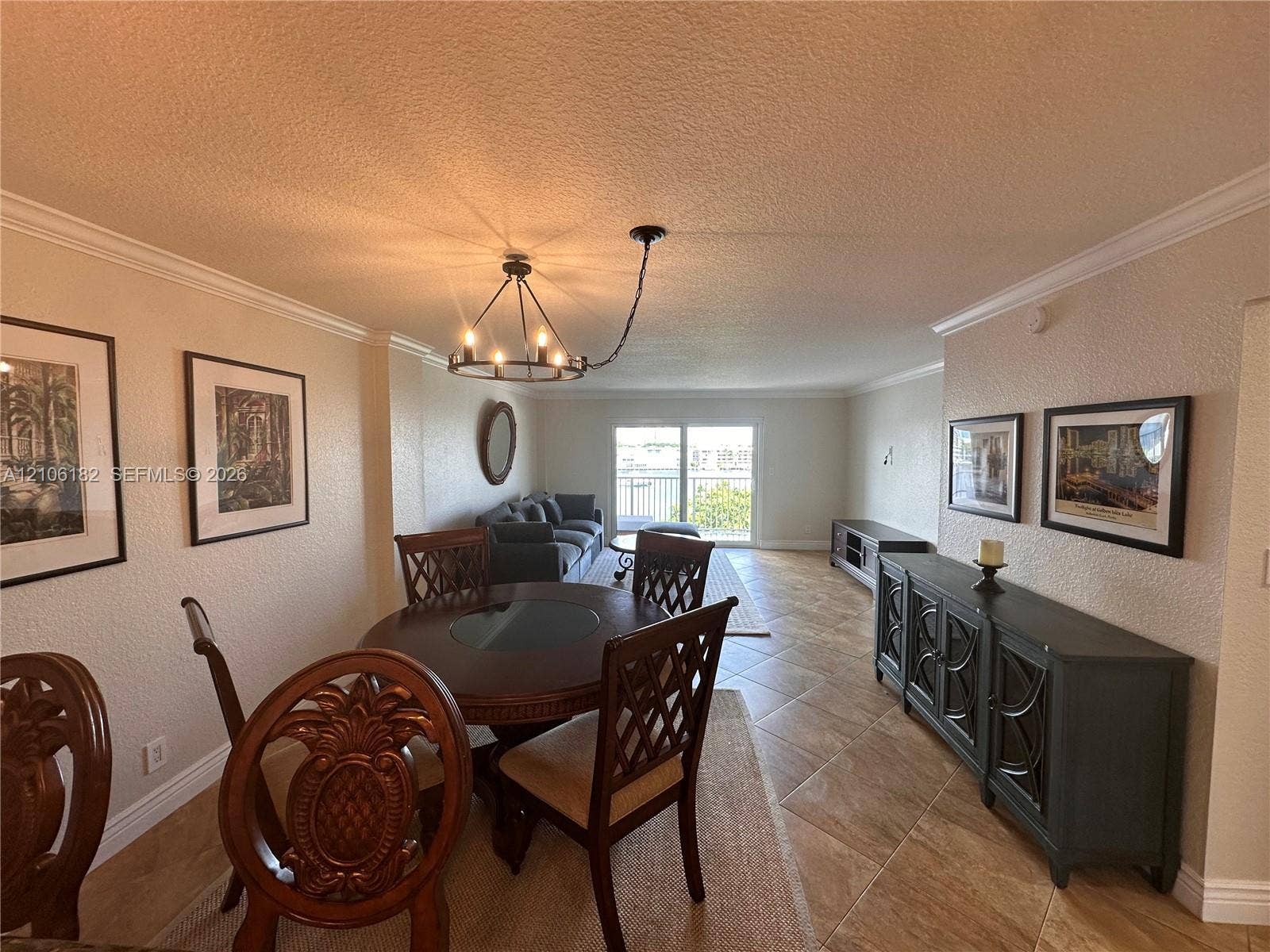 400 Golden Isles Drive, #40, Hallandale Beach, Hallandale Beach, FL 33009 Open interior featuring diagonal tile flooring, crown molding, and a custom chandelier