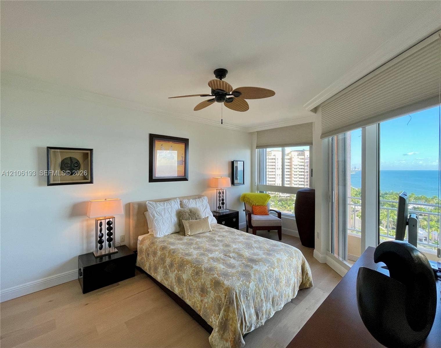 799 Crandon Boulevard, #1203, Key Biscayne, Key Biscayne, FL 33149 Floor-to-ceiling windows, light wood-finish flooring, ceiling fan, and coastal horizon backdrop