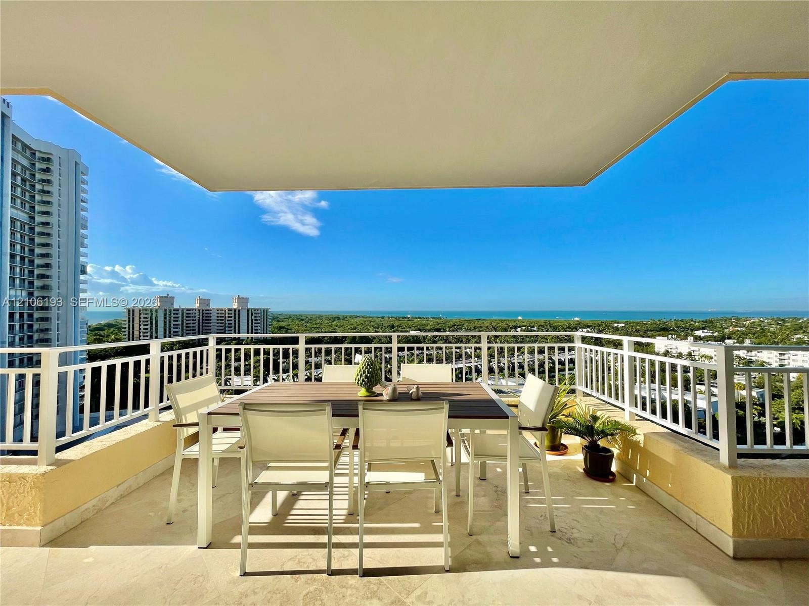 799 Crandon Boulevard, #1203, Key Biscayne, Key Biscayne, FL 33149 Covered balcony featuring stone flooring and white metal railing