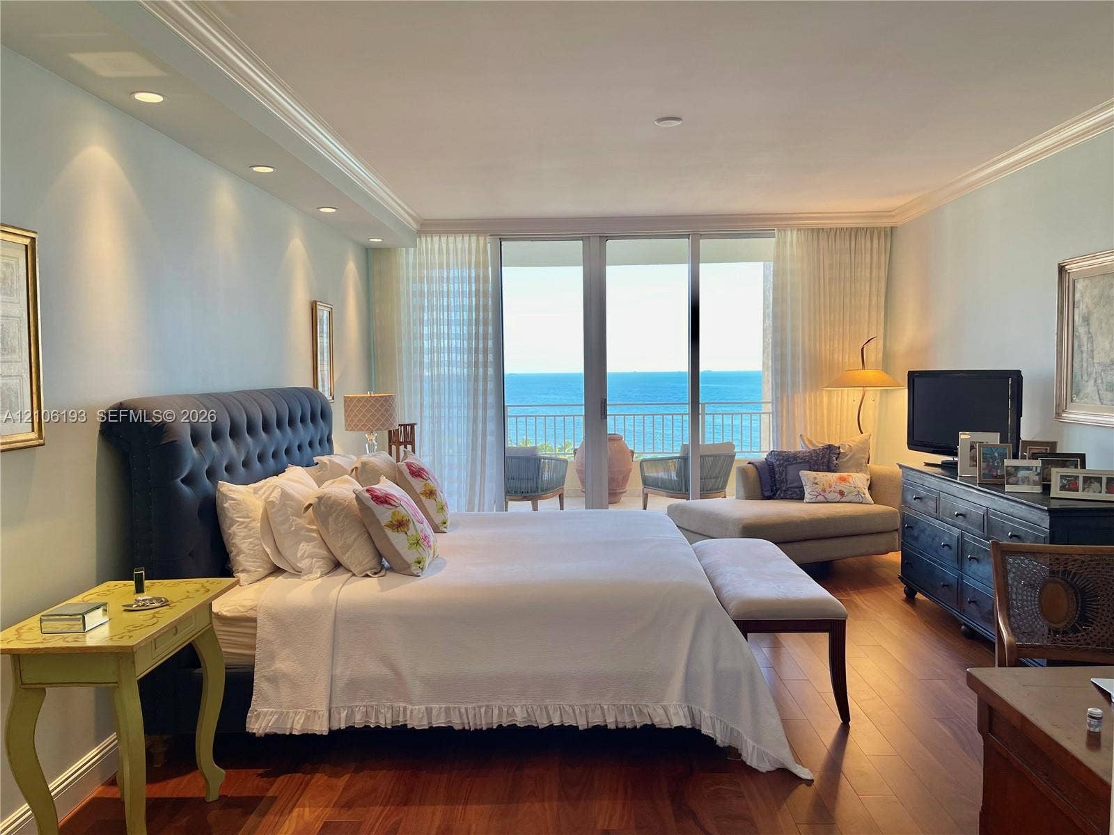 799 Crandon Boulevard, #1203, Key Biscayne, Key Biscayne, FL 33149 Bedroom featuring wood-finish flooring, recessed lighting, crown molding, and floor-to-ceiling glass sliding doors opening to a balcony with ocean exposure