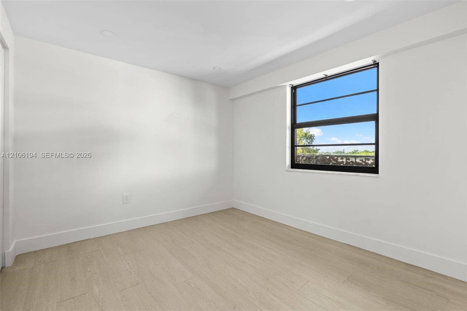 777 SW 9th Avenue, #408, Miami, FL 33130 Neutral-toned interior space featuring recessed lighting, and a single-hung window with a black frame