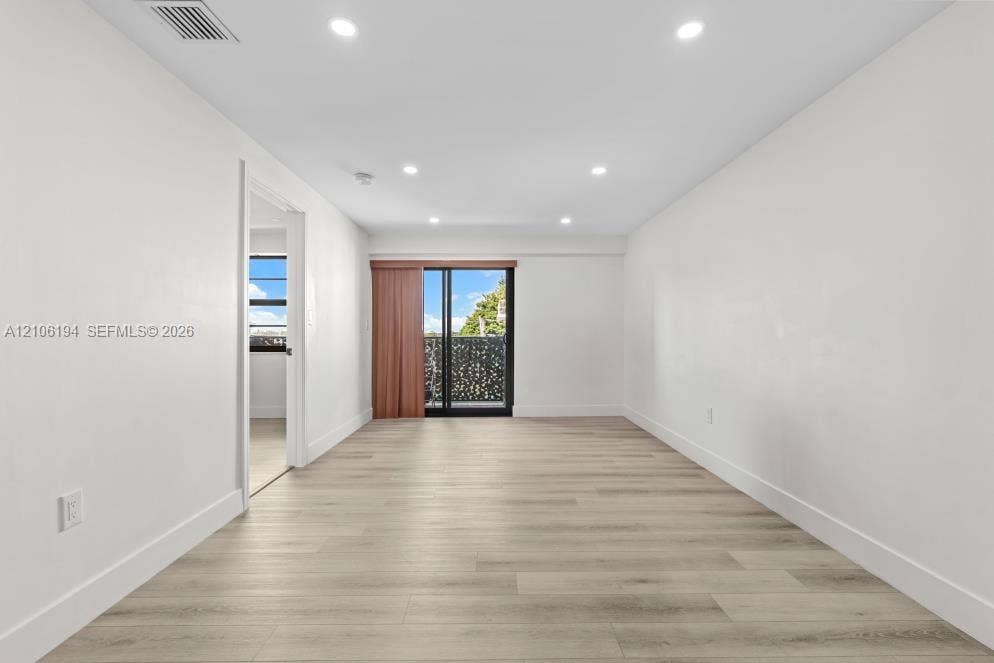 777 SW 9th Avenue, #408, Miami, FL 33130 Interior space featuring recessed lighting, and a sliding glass door with a decorative metal balcony screen