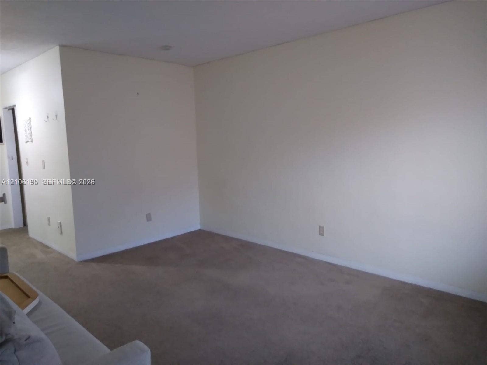 8132 Harding Avenue, #11, Miami Beach, Miami Beach, FL 33141 Neutral wall finish with carpeting and flush-mount ceiling lighting
