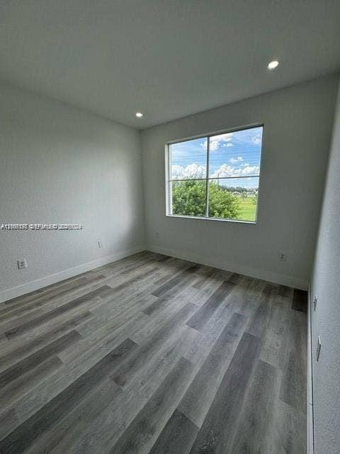17660 NW 73rd Avenue, #202-3, Hialeah, Hialeah, FL 33015 Neutral wall finishes, recessed ceiling lighting, and expansive wood-finish flooring