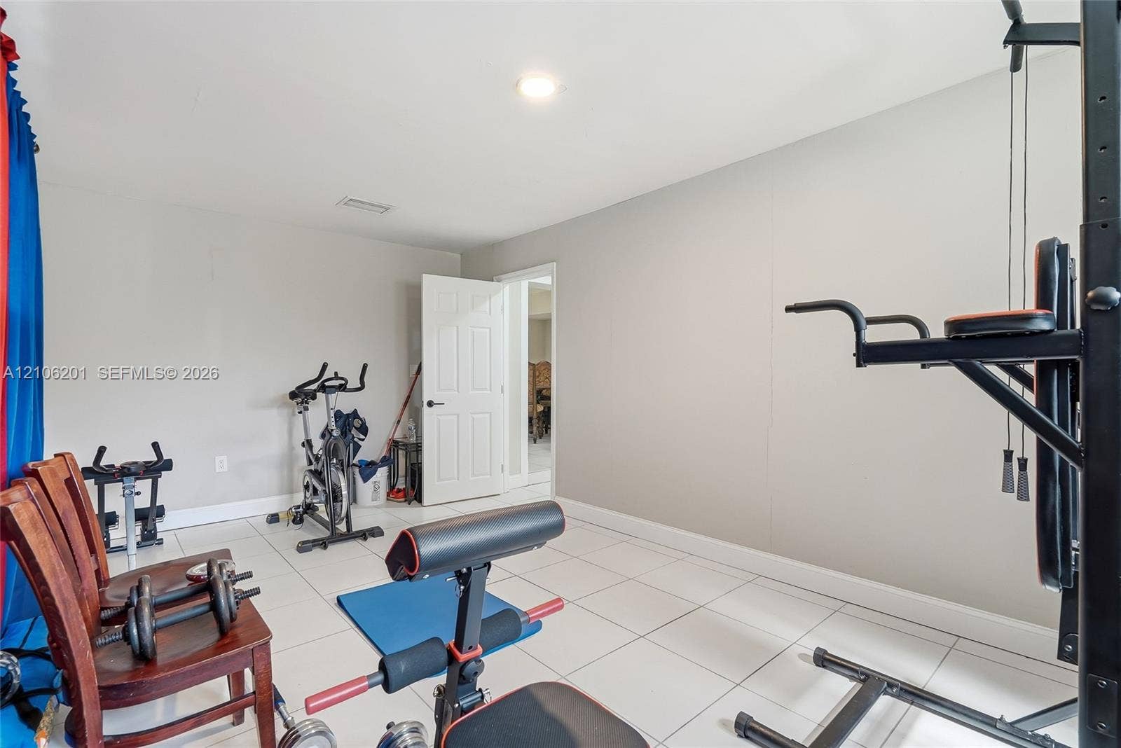 Room featuring large-format ceramic tile flooring, neutral wall paint, and recessed ceiling lighting