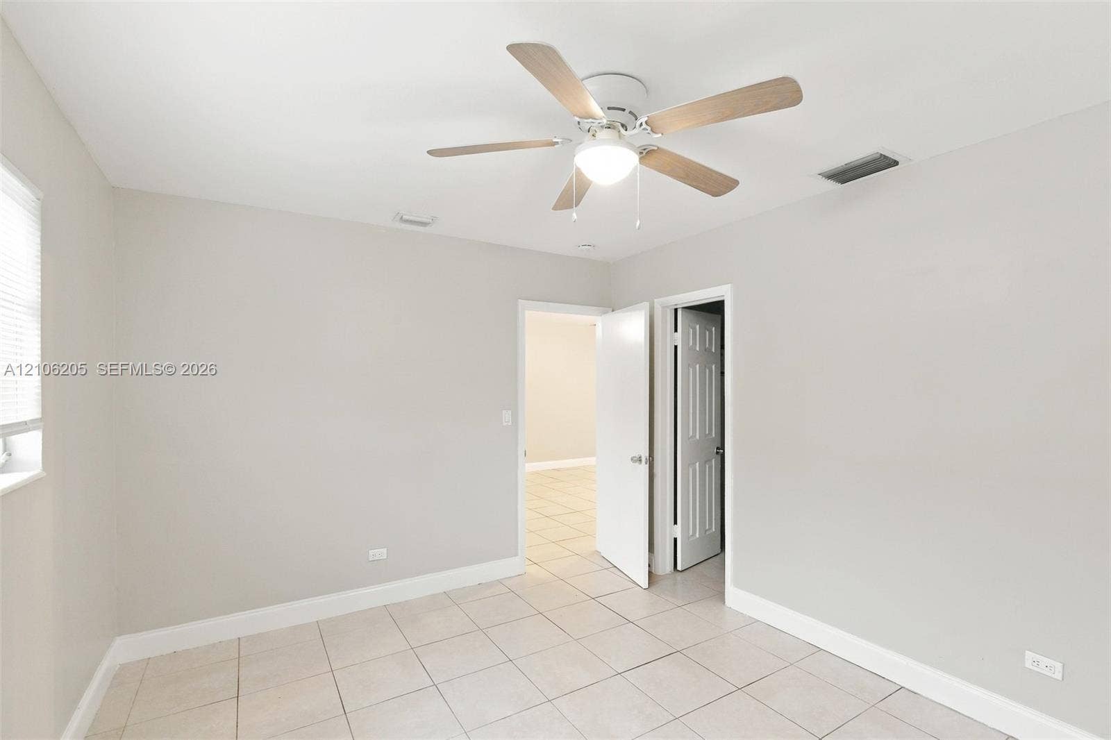 6941 SW 5th Street, Pembroke Pines, Pembroke Pines, FL 33023 Interior room featuring neutral wall paint, tile flooring, and a ceiling fan with integrated light fixture