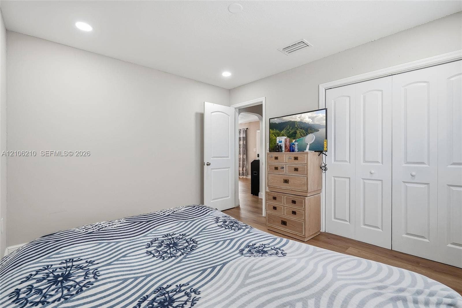 1111 S 7th Street, Fort Pierce, FL 34950 Neutral-toned interior featuring wood-finish flooring, recessed lighting, and double-panel closet doors