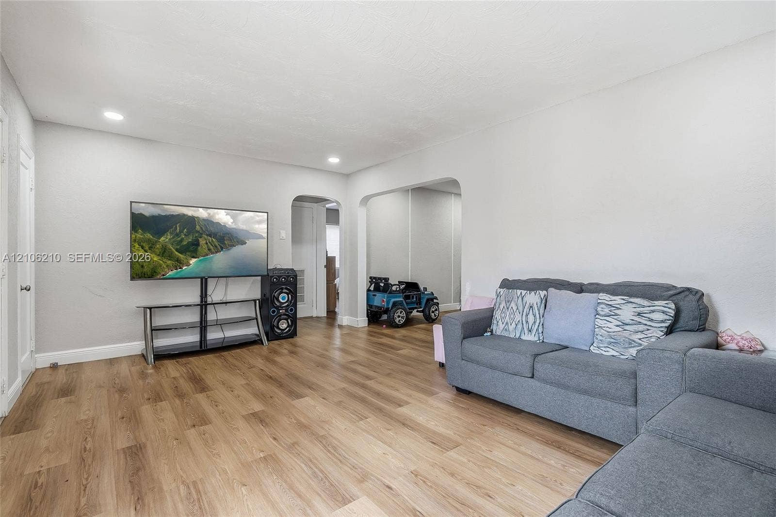 1111 S 7th Street, Fort Pierce, FL 34950 Interior space featuring wood-finish flooring, recessed lighting, and arched doorways