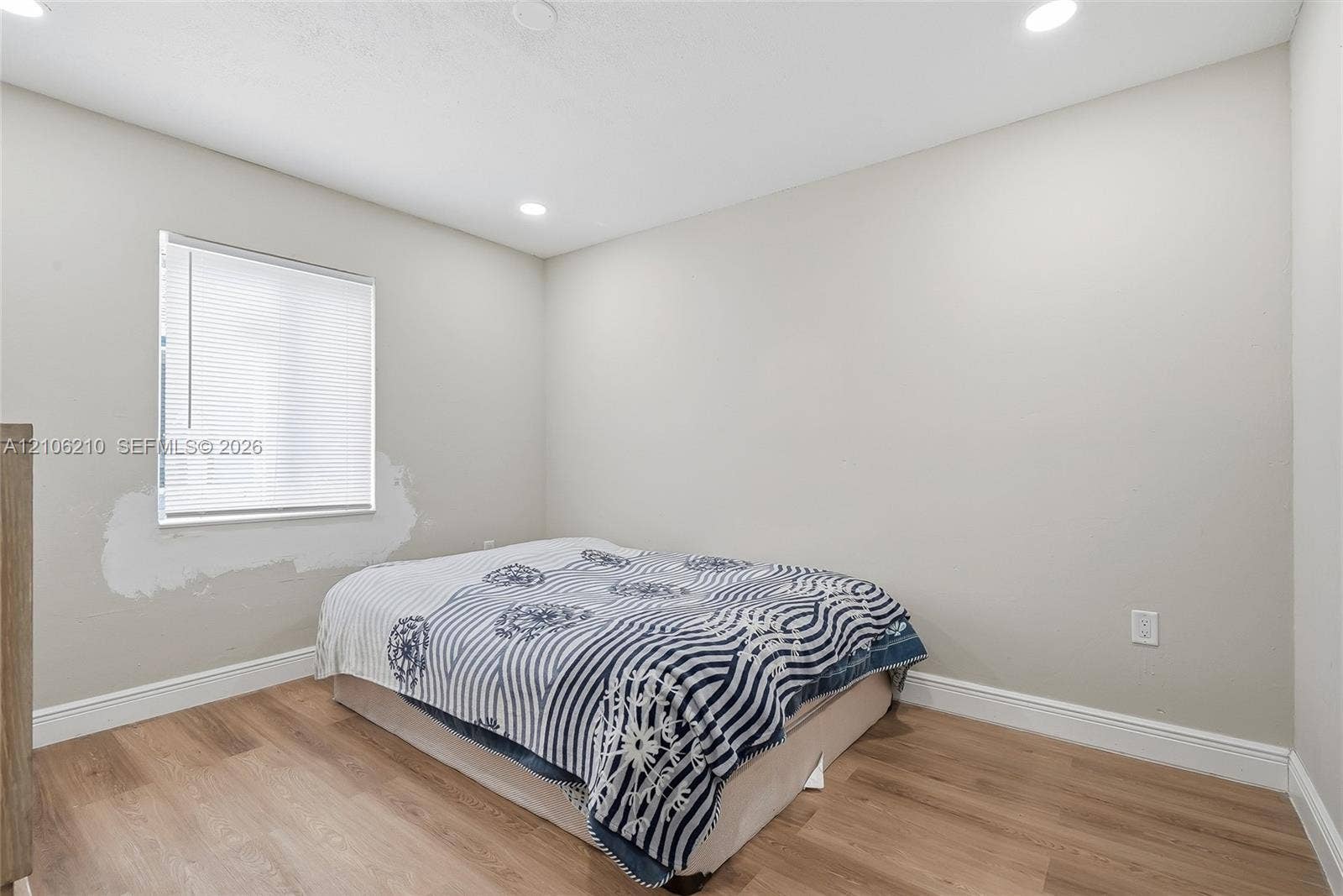 1111 S 7th Street, Fort Pierce, FL 34950 Neutral wall color, wood-finish flooring, and recessed ceiling lighting