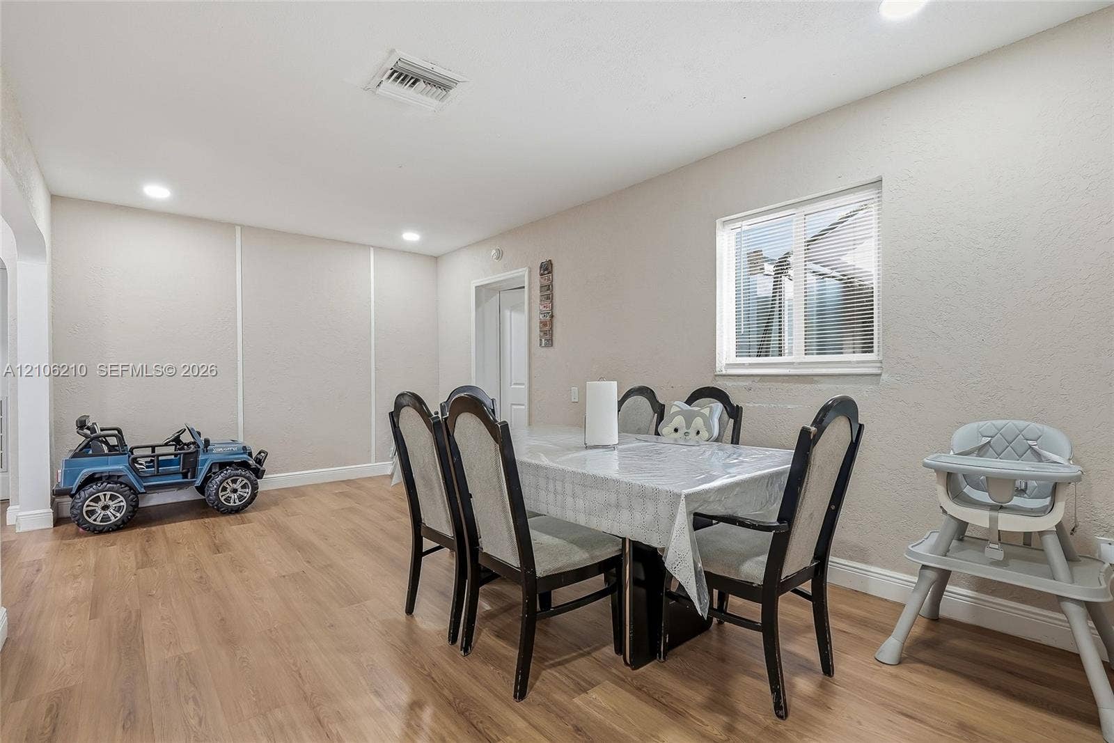 1111 S 7th Street, Fort Pierce, FL 34950 Interior space featuring wood-finish flooring, recessed lighting, and a dual-pane window
