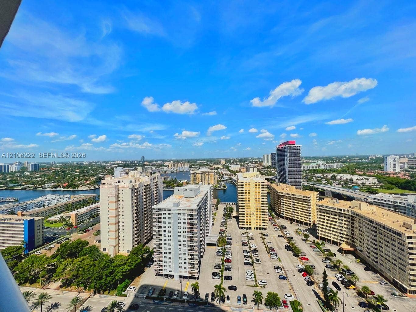 High-rise perspective featuring expansive urban scenery and water elements