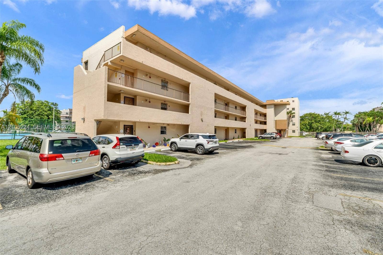 8887 Fontainebleau Boulevard, #206, Miami, Miami, FL 33172 Multi-level stucco exterior featuring private balconies and surface parking