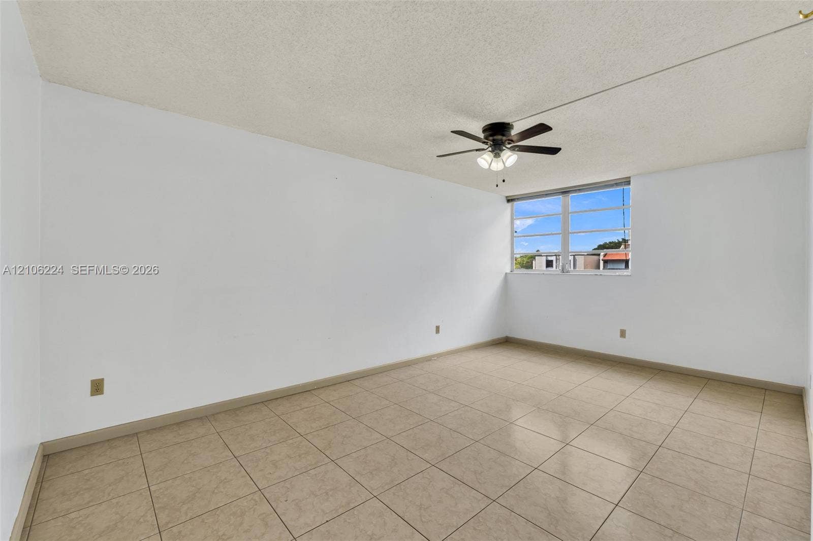 8887 Fontainebleau Boulevard, #206, Miami, Miami, FL 33172 Interior space featuring tile flooring, a multi-pane window, and a ceiling fan with integrated lighting