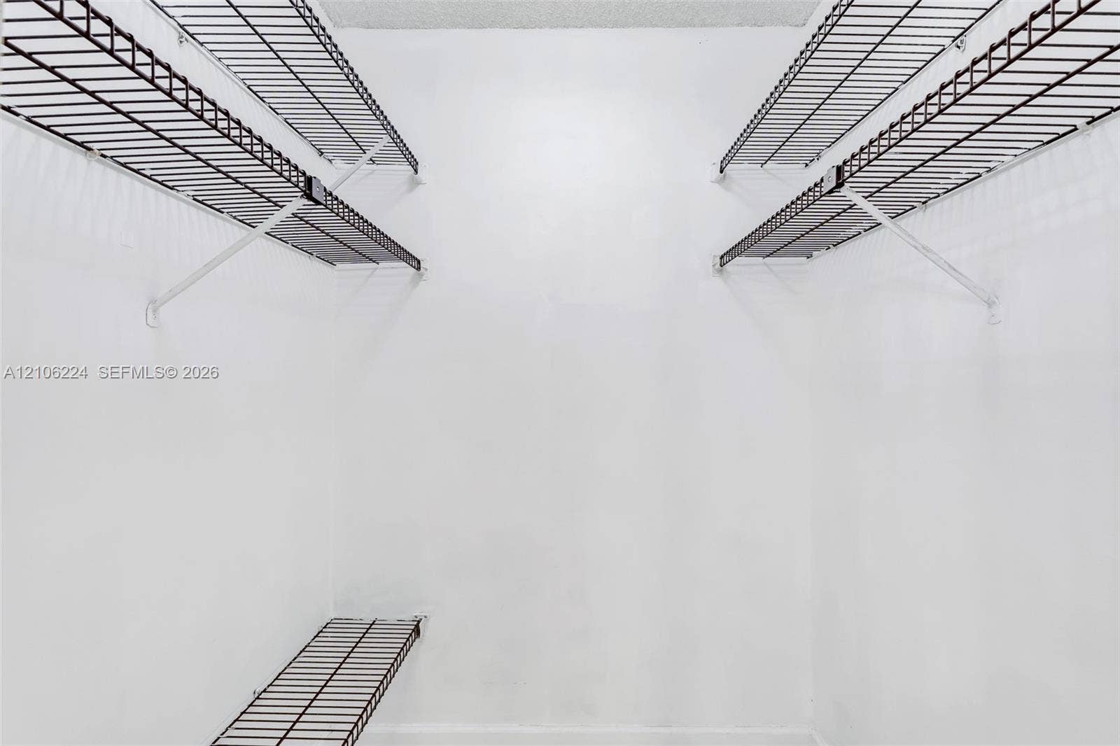 8887 Fontainebleau Boulevard, #206, Miami, Miami, FL 33172 Storage area featuring multi-level wire shelving units and white walls