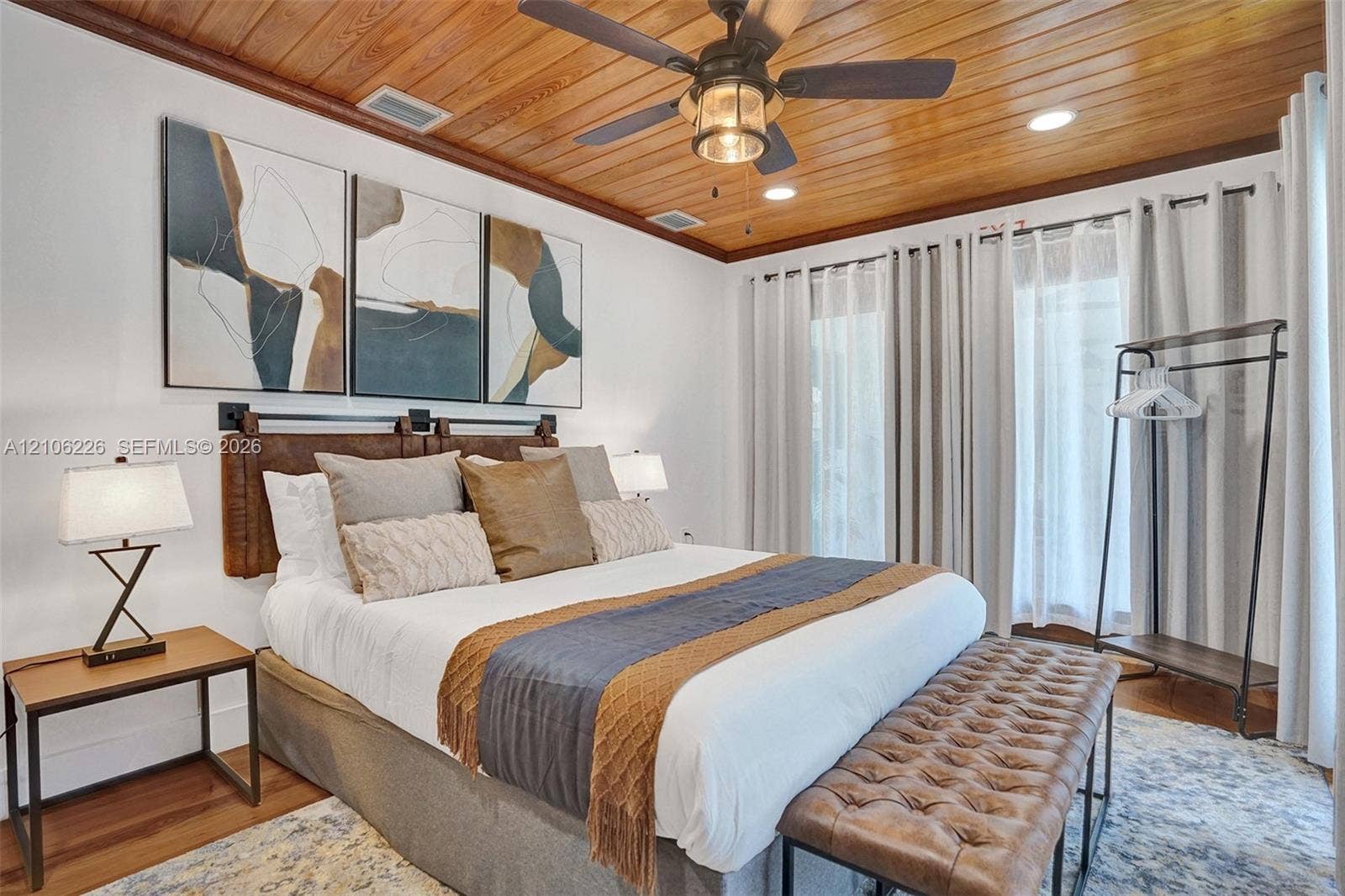 11155 SW 40th Street, Davie, FL 33328 Vaulted wood-plank ceiling featuring an integrated metal-and-glass ceiling fan with recessed lighting