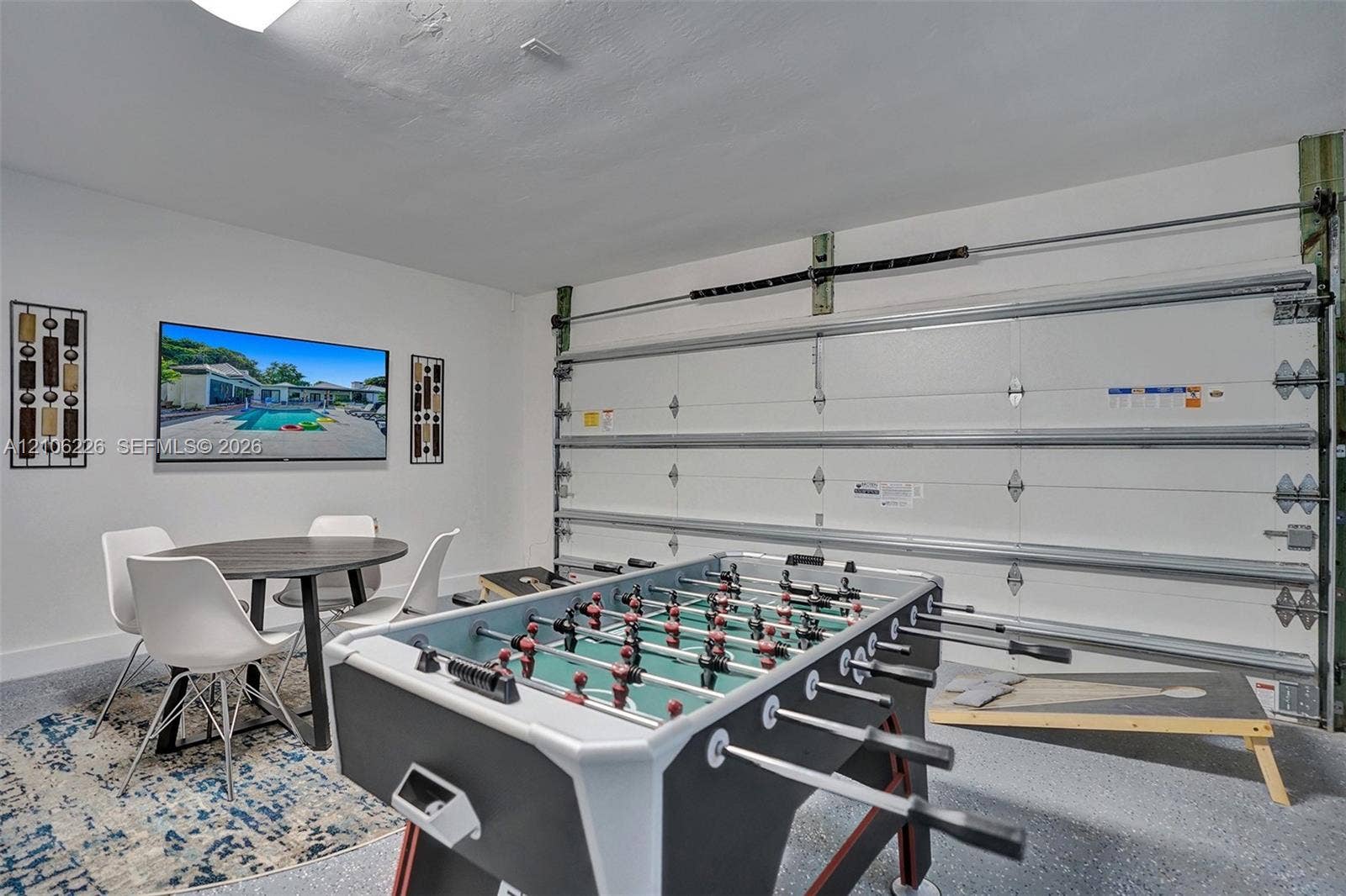 11155 SW 40th Street, Davie, FL 33328 Finished interior space with epoxy-coated flooring, insulated roll-up garage door, and bright recessed lighting
