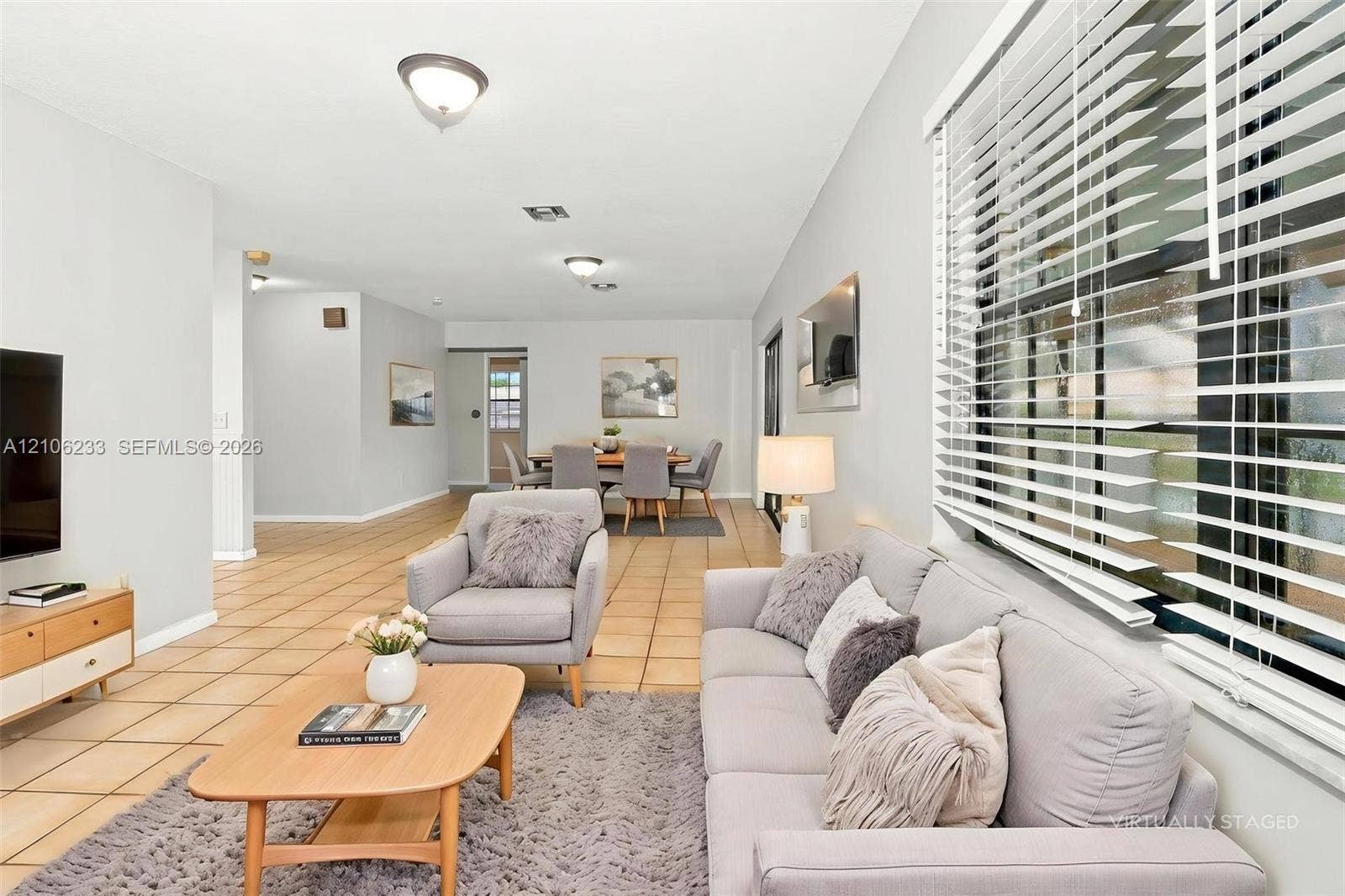 132 Santander Court, Royal Palm Beach, Royal Palm Beach, FL 33411 Open-concept interior featuring light-toned tile flooring, large multi-pane windows, and recessed ceiling lighting