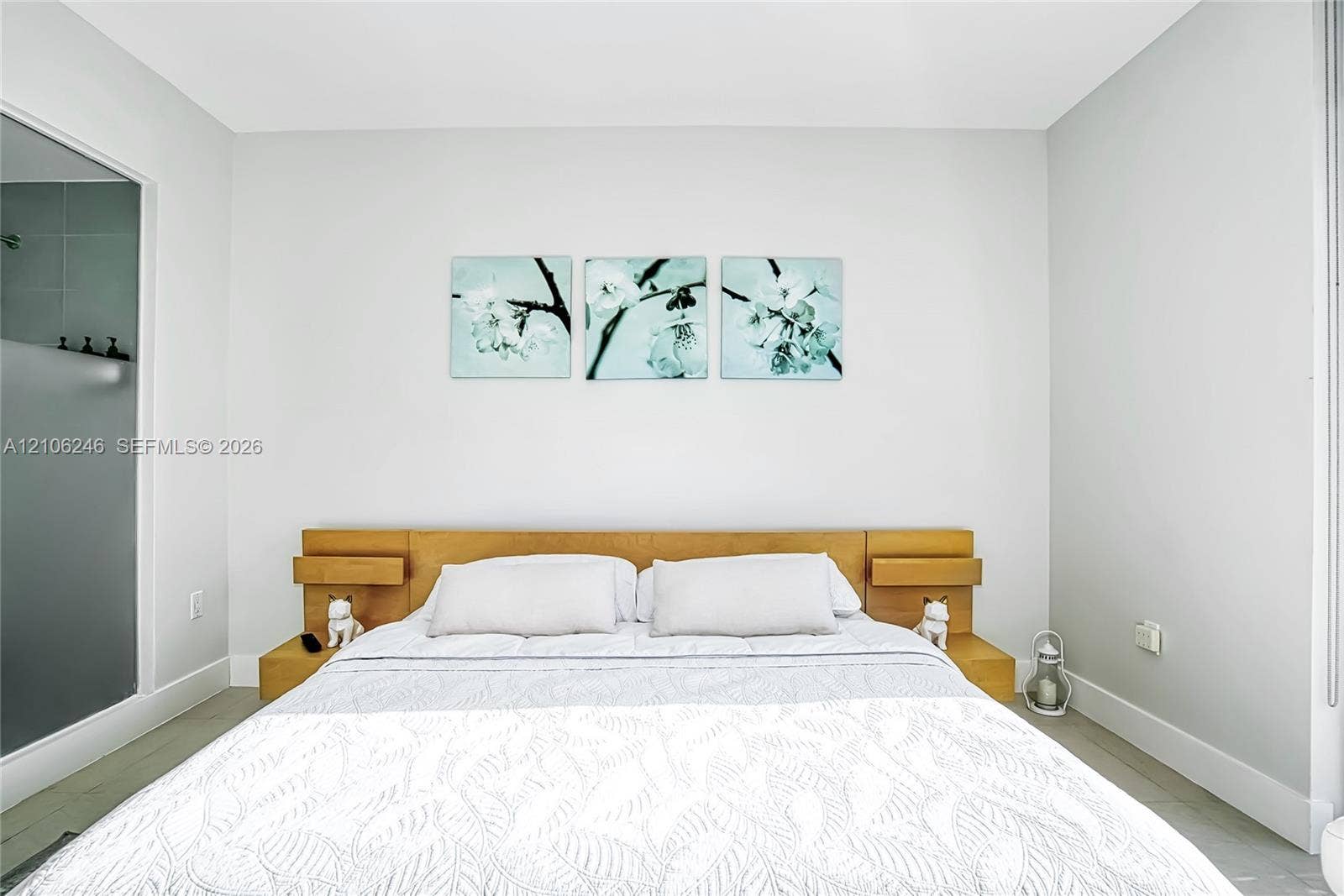 92 SW 3rd Street, #1511, Miami, Miami, FL 33130 Built-in wood-finish headboard featuring integrated side shelving and neutral wall finishes