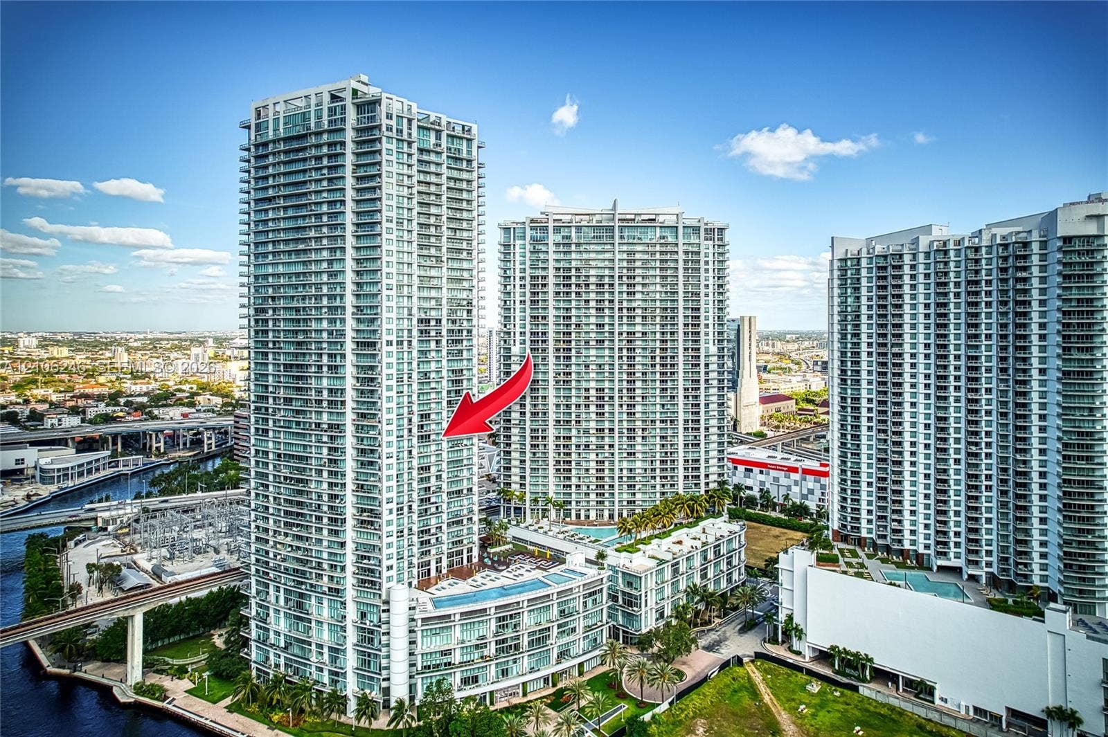 92 SW 3rd Street, #1511, Miami, Miami, FL 33130 High-rise glass facade featuring wraparound balconies and a central concrete structural design