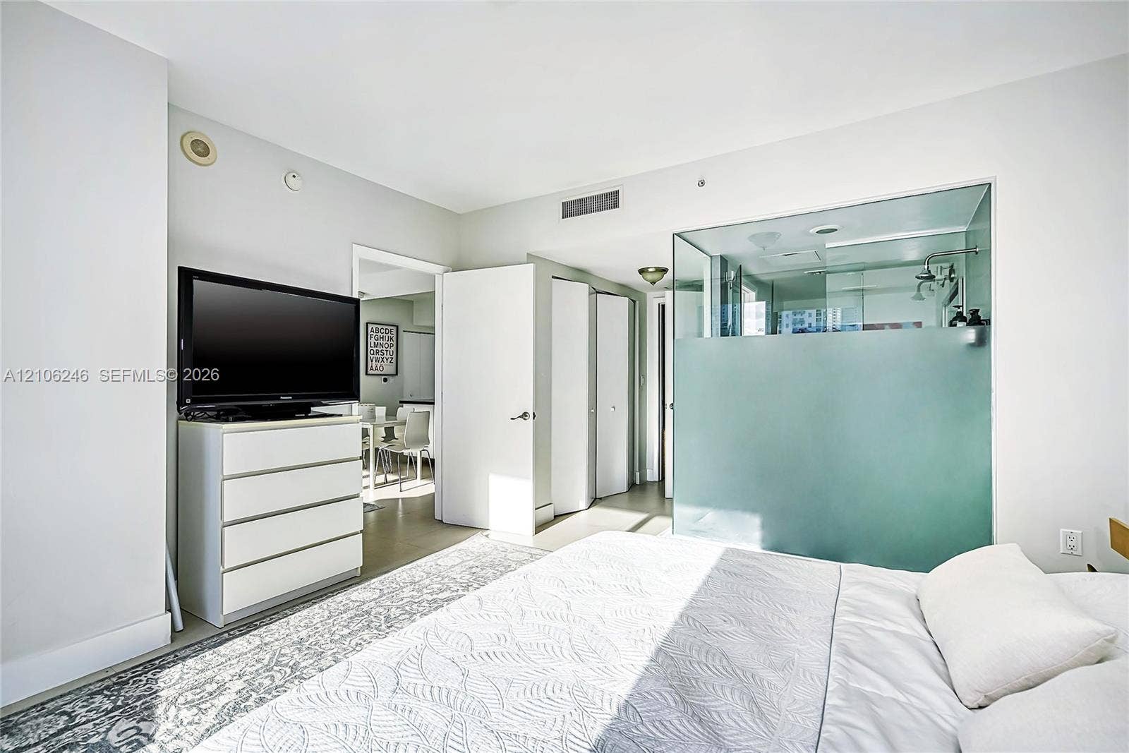 92 SW 3rd Street, #1511, Miami, Miami, FL 33130 Glass-enclosed shower with frosted privacy panel, ceiling-mounted sprinkler head, and smooth-finish walls