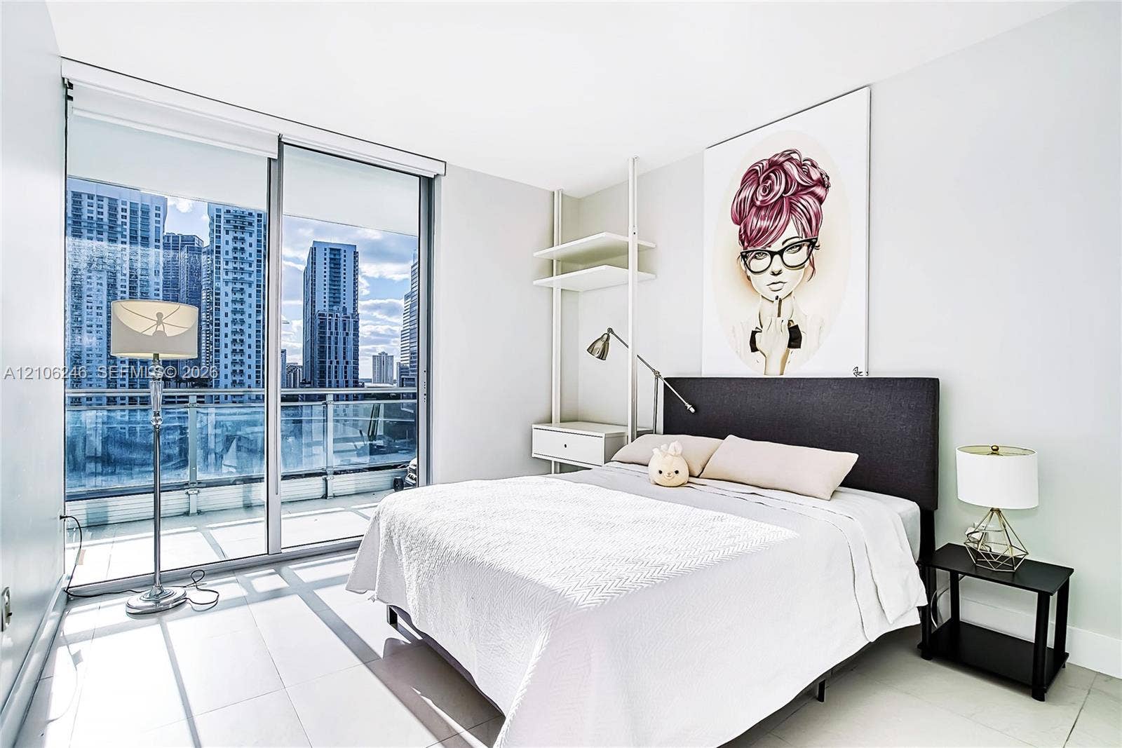 92 SW 3rd Street, #1511, Miami, Miami, FL 33130 Floor-to-ceiling glass sliding doors, private balcony with glass railing, large-format tile flooring, and custom built-in shelving unit