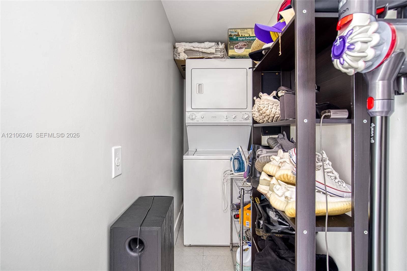 92 SW 3rd Street, #1511, Miami, Miami, FL 33130 Stacked white laundry unit featuring integrated dryer and washing machine
