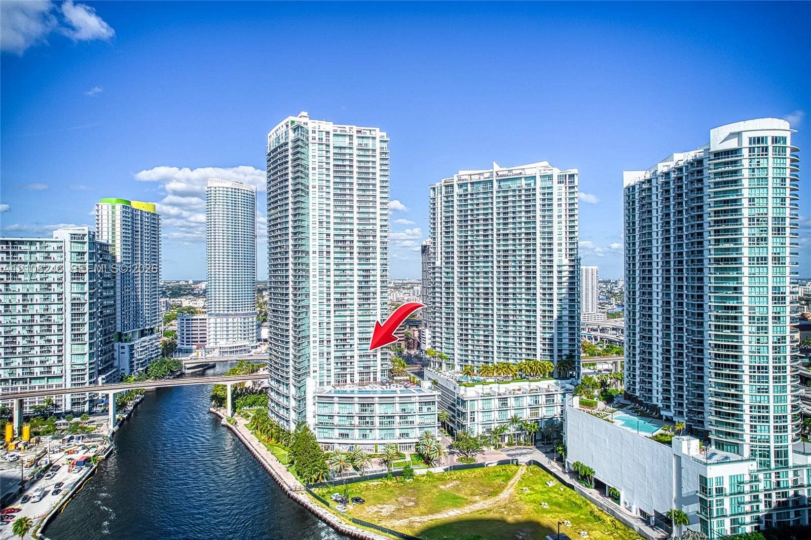 92 SW 3rd Street, #1511, Miami, Miami, FL 33130 High-rise glass and concrete residential tower featuring private balconies, multi-story podium architecture, and waterfront positioning