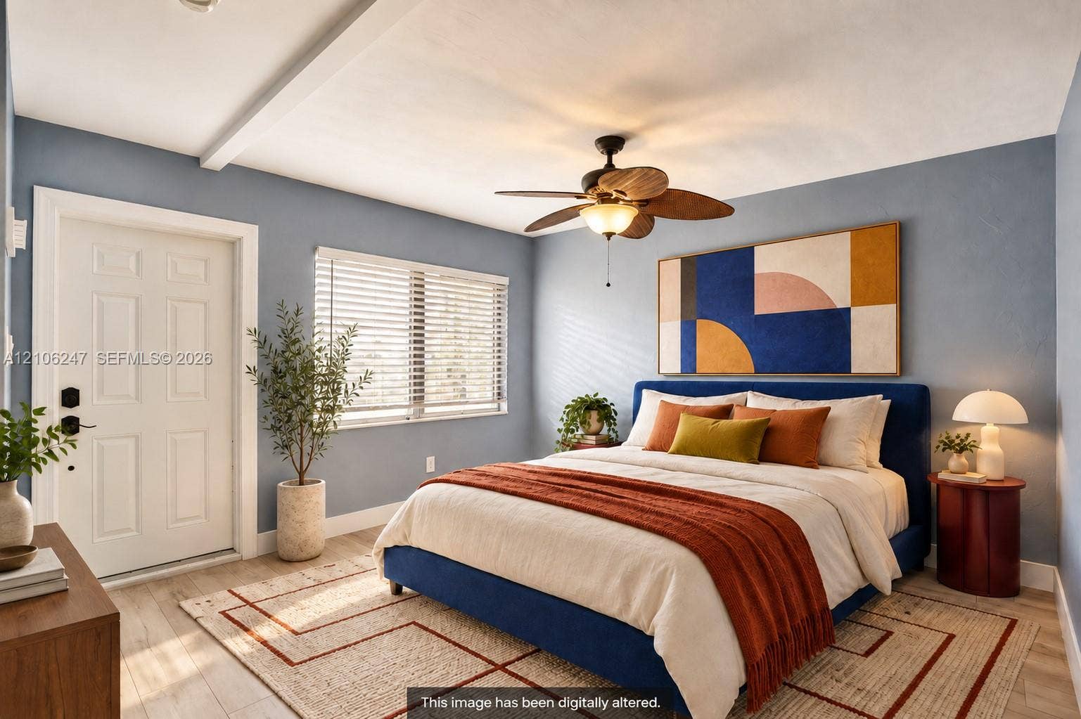 1037 N Victoria Park Road, #2, Fort Lauderdale, Fort Lauderdale, FL 33304 Bedroom interior featuring wood-finish flooring, a ceiling fan with integrated lighting, and a six-panel door