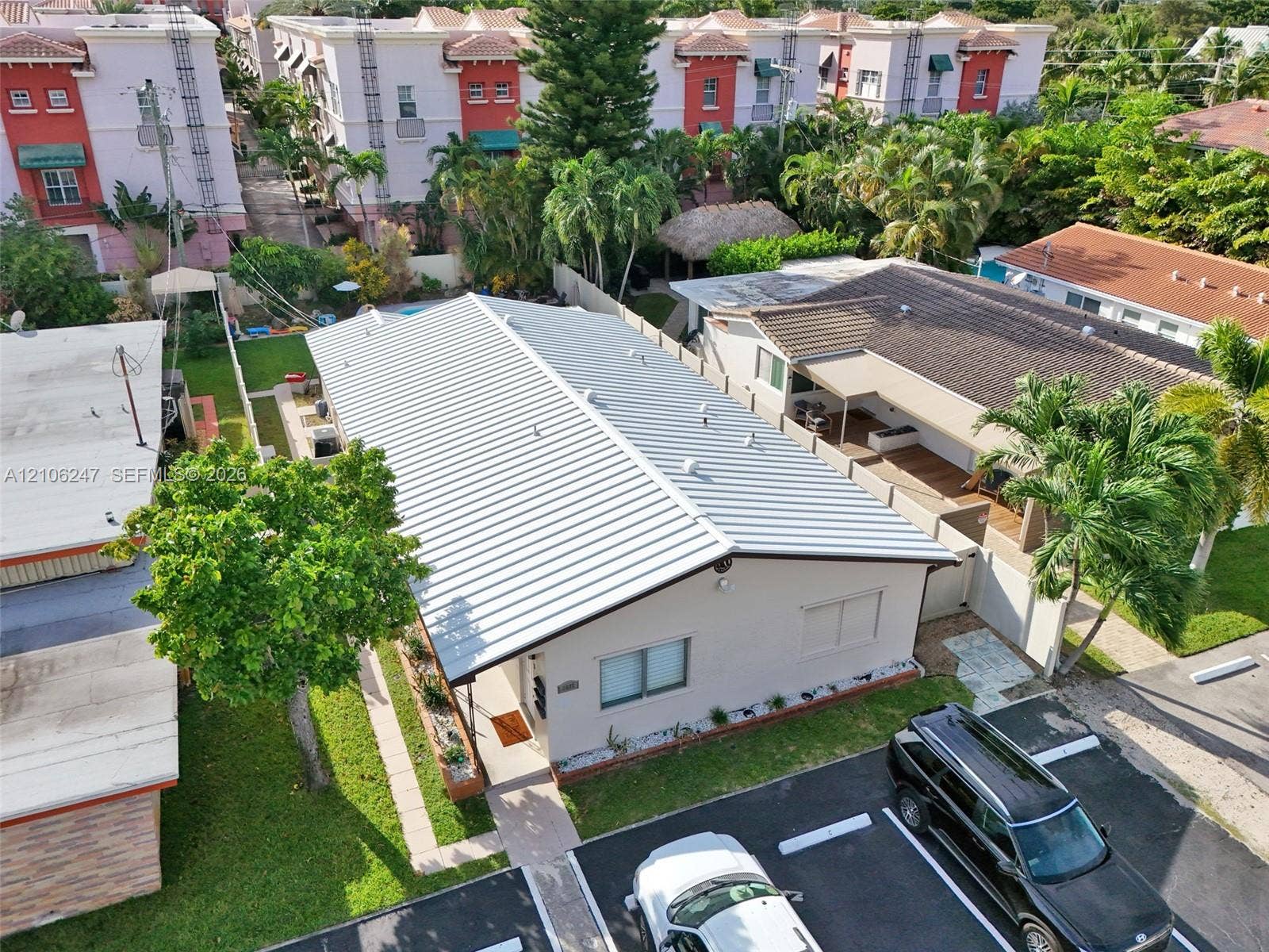 1037 N Victoria Park Road, #2, Fort Lauderdale, Fort Lauderdale, FL 33304 Single-story structure featuring a standing seam metal roof, exterior stucco siding, and a paved parking area