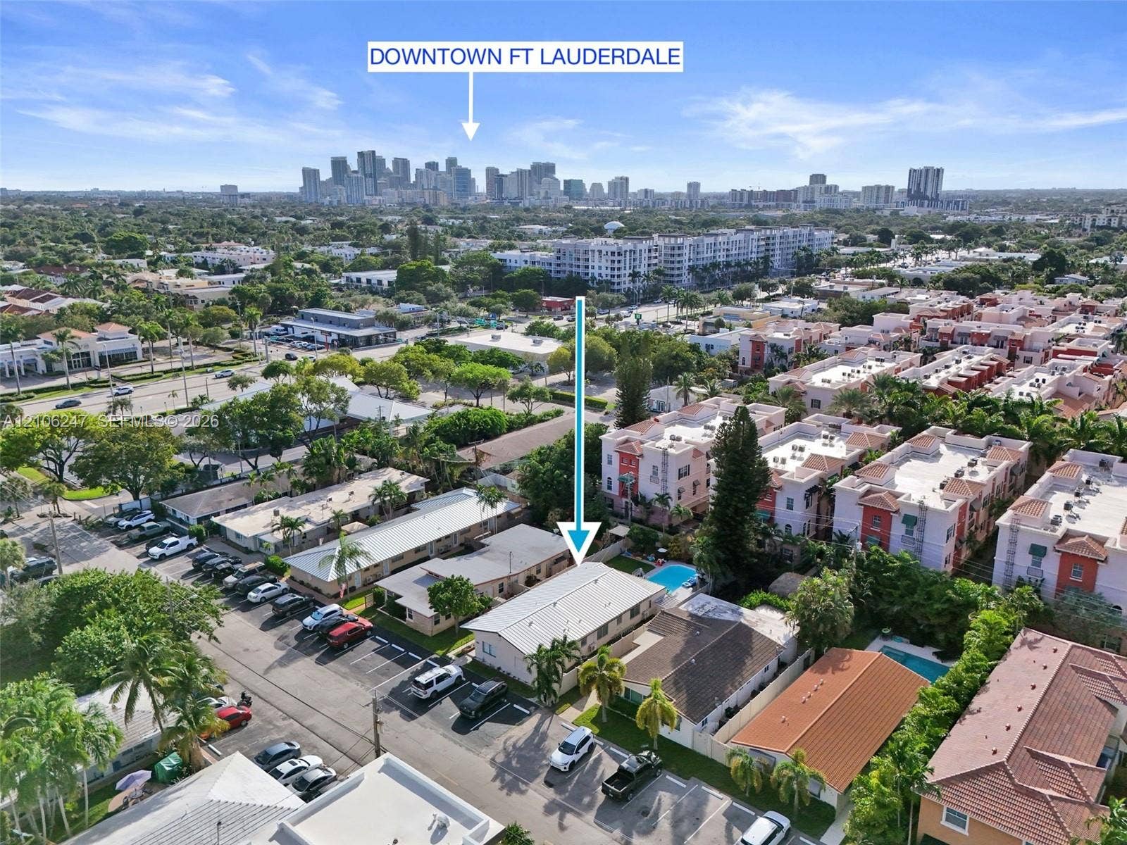 1037 N Victoria Park Road, #2, Fort Lauderdale, Fort Lauderdale, FL 33304 Aerial perspective of property featuring an outdoor swimming pool, paved surface parking, and proximity to the Downtown Fort Lauderdale skyline