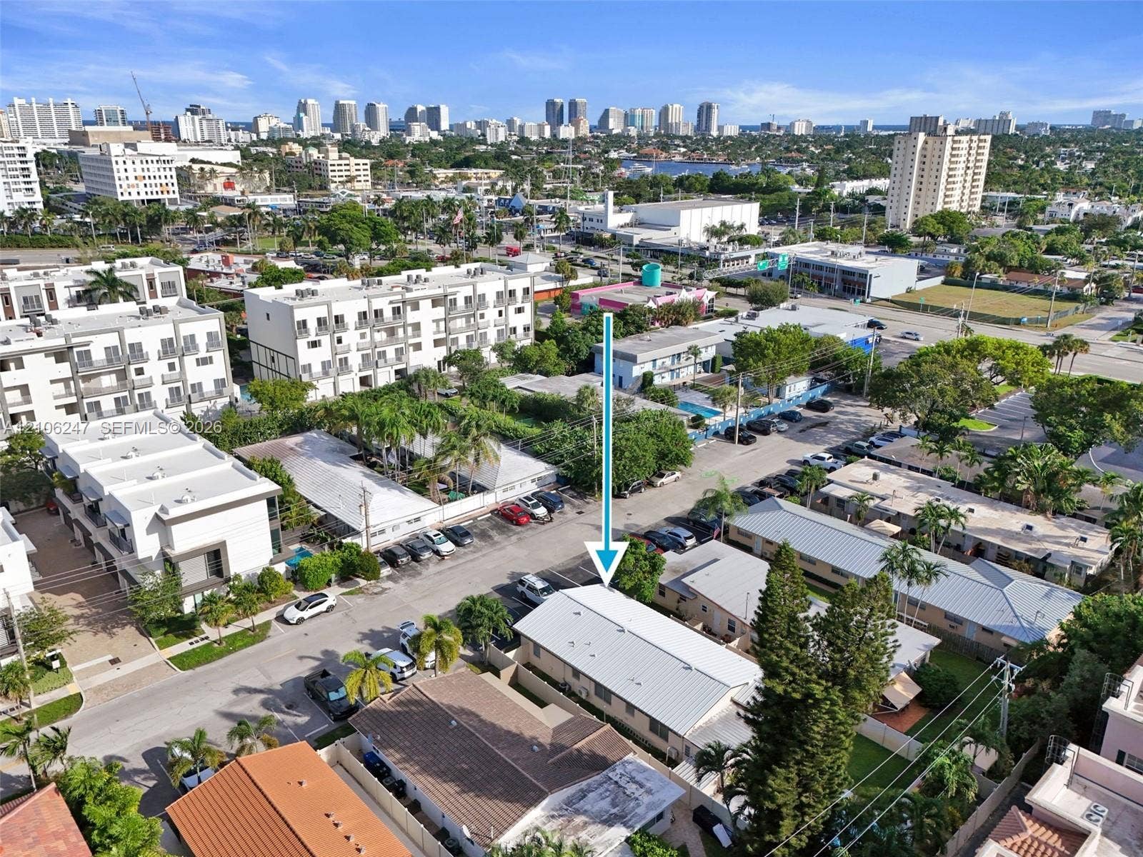 1037 N Victoria Park Road, #2, Fort Lauderdale, Fort Lauderdale, FL 33304 Aerial perspective of a low-rise residential property featuring a light-colored metal roof, private enclosed yard space, and mature perimeter trees