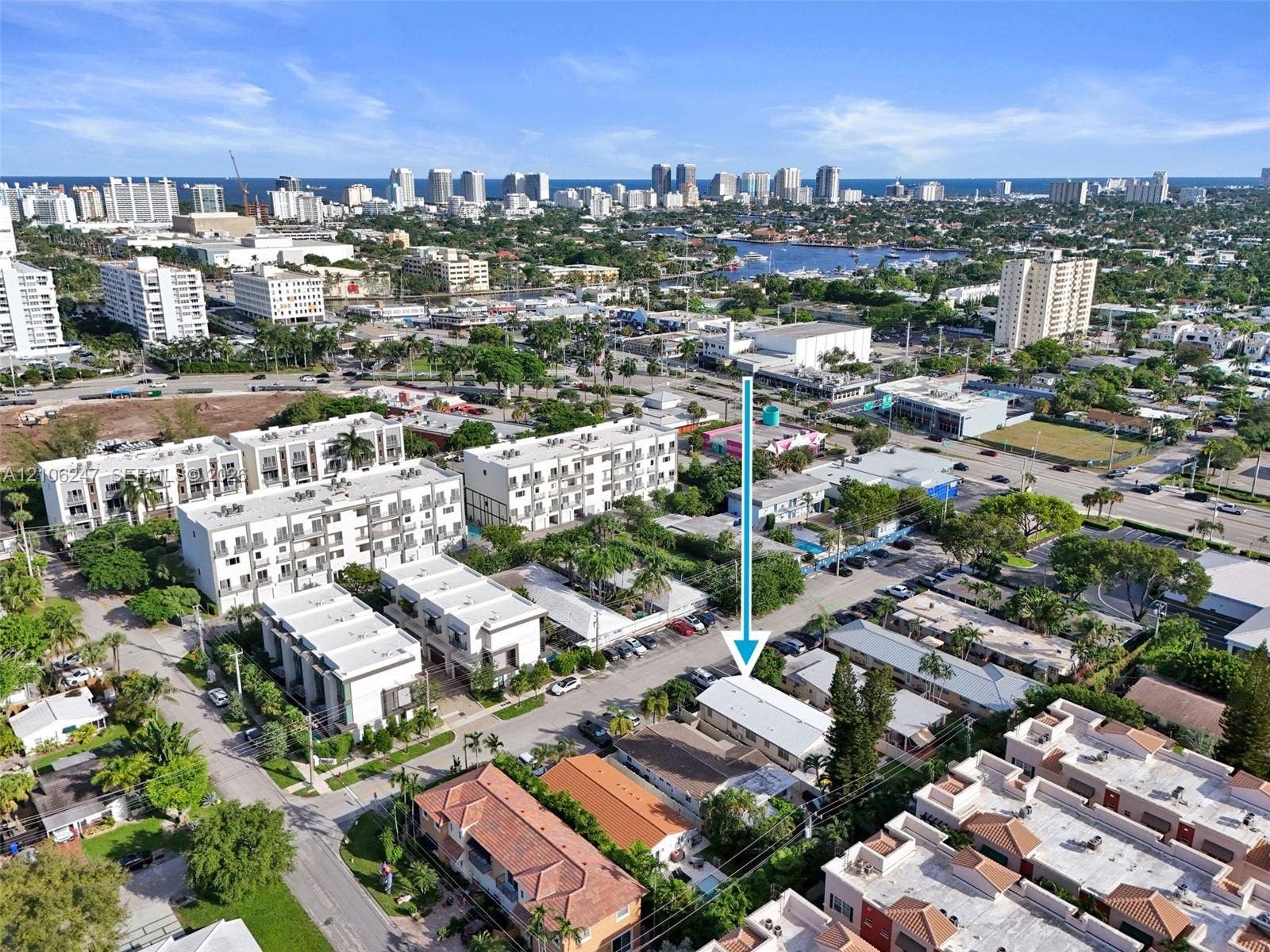 1037 N Victoria Park Road, #2, Fort Lauderdale, Fort Lauderdale, FL 33304 Aerial perspective of a multi-unit residential structure featuring a light-toned exterior finish, a flat roofline, and mature surrounding landscaping