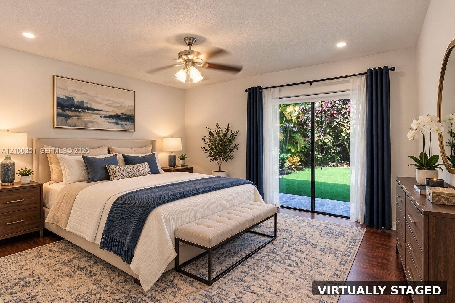 Bedroom featuring wood-finish flooring, recessed lighting, a ceiling fan with integrated light fixture, and sliding glass doors with exterior access