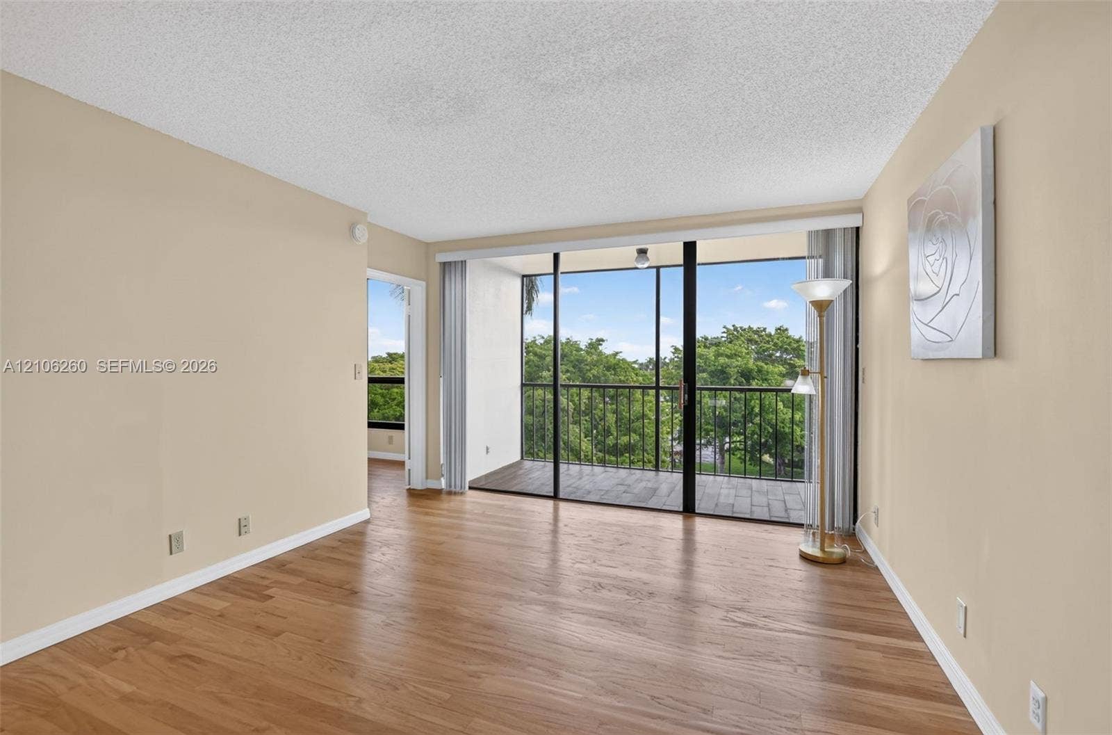 5951 Wellesley Park Drive, #508, Boca Raton, FL 33433 full-height sliding glass doors, and a screened balcony with a metal railing