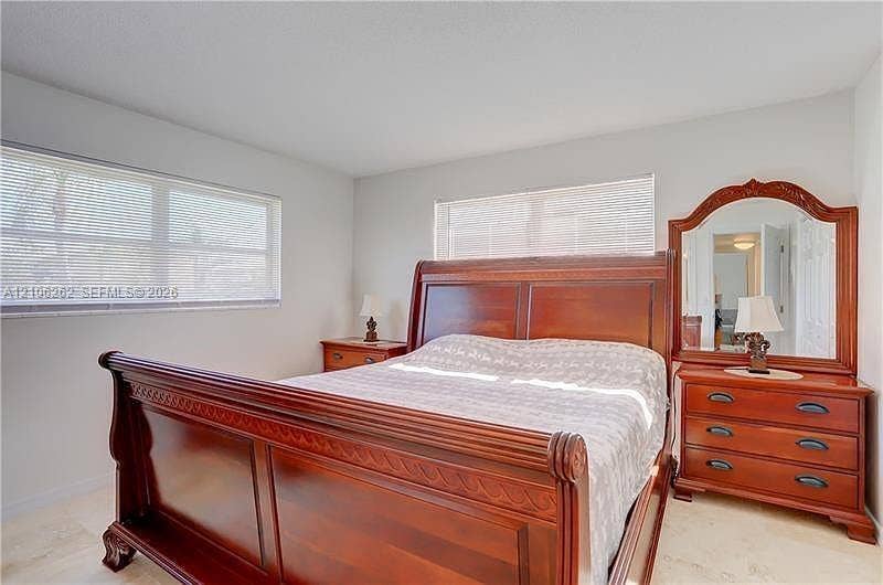 2212 NE 1st Way, #101, Boynton Beach, FL 33435 Neutral walls, large windows, and tile flooring