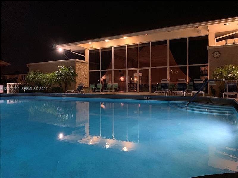 2212 NE 1st Way, #101, Boynton Beach, FL 33435 In-ground swimming pool featuring a stepped entry and concrete decking