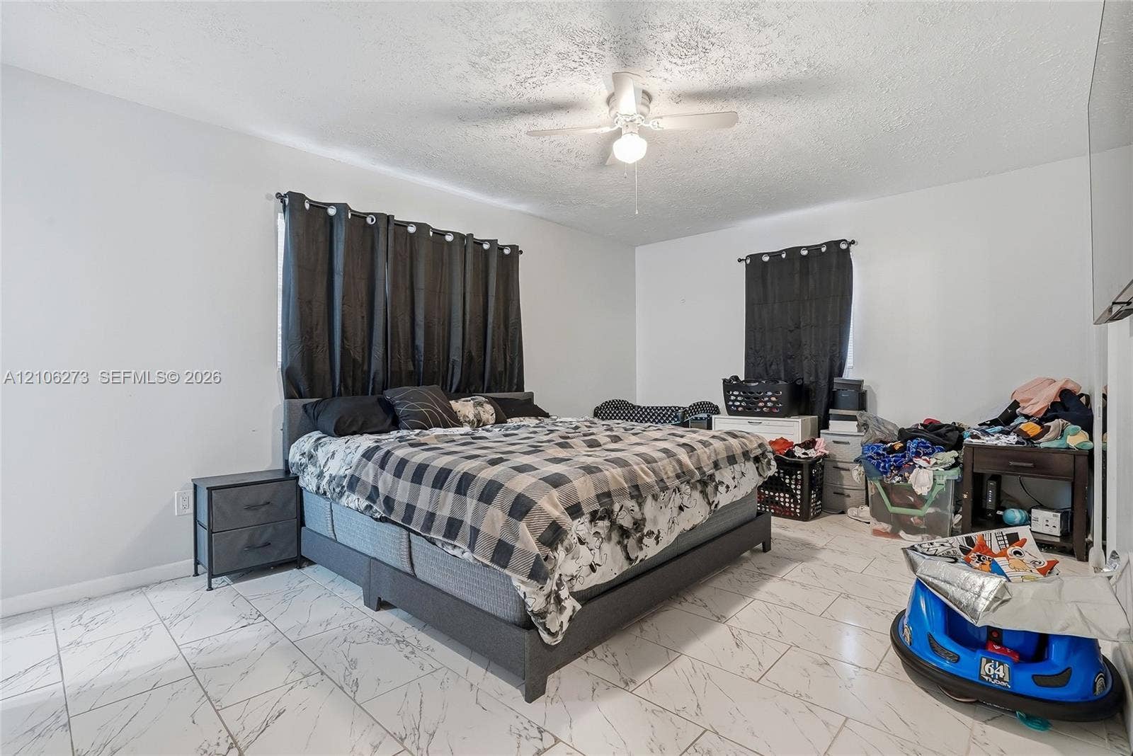 5310 Seagrape Drive, Fort Pierce, FL 34982 Room featuring white stone-finish flooring and a central ceiling fan with integrated light fixture